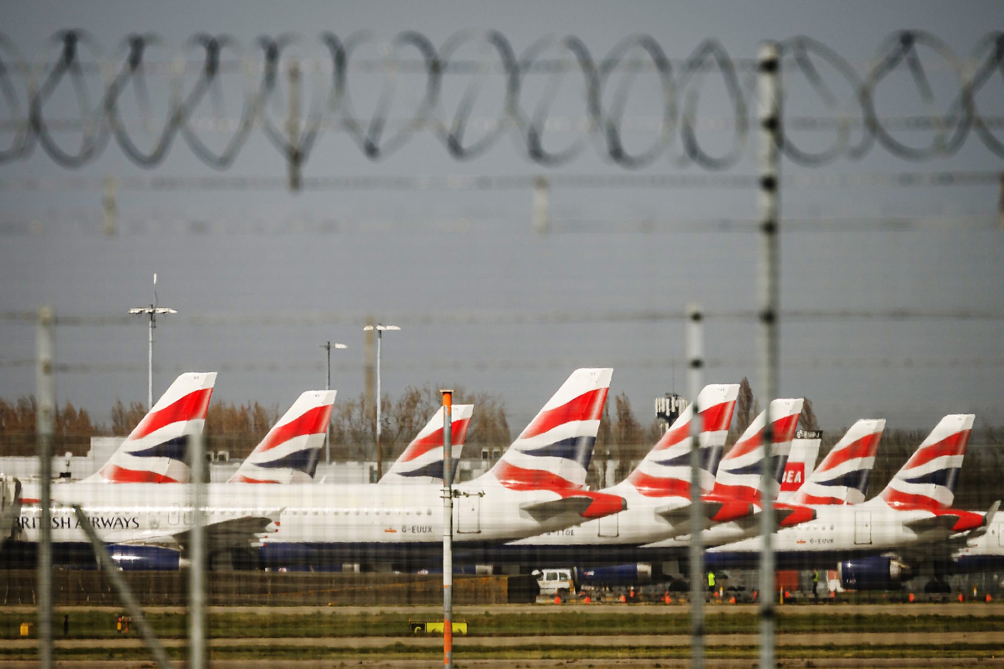 Passenger aircraft operated by British Airways sit on the tarmac at London Heathrow Airport on March 21, 2025.