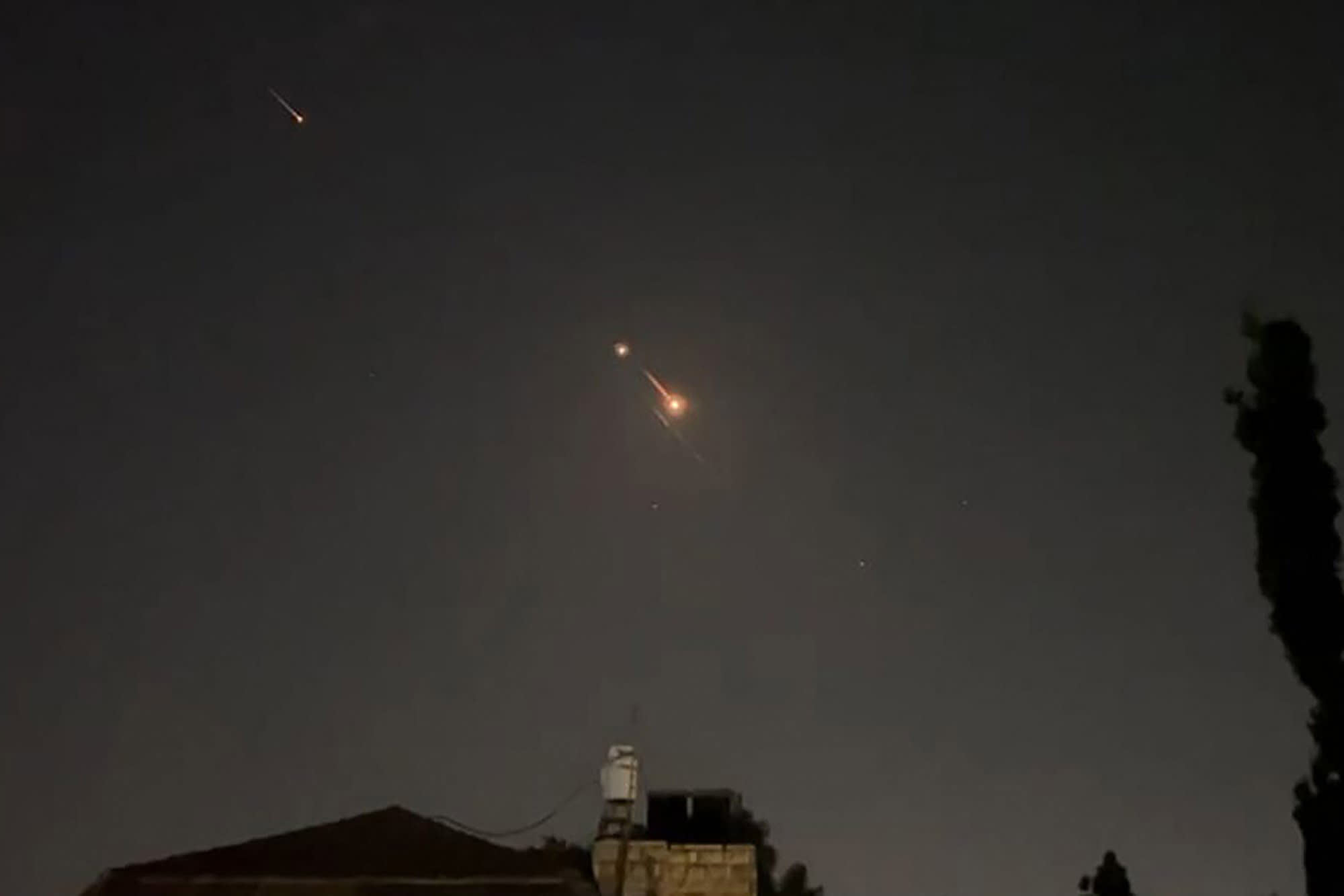 Explosions light up the sky over Jerusalem during Iran's attack early April 14, 2024.
