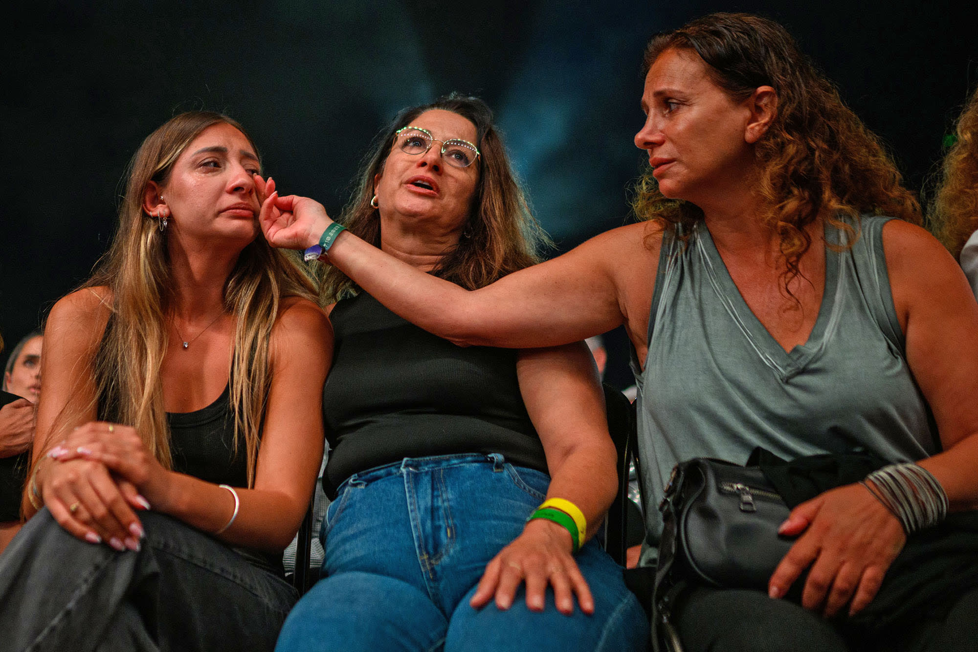 Relatives and friends of people killed on Oct. 7th cry during a ceremony commemorating the anniversary on Oct. 7, 2024 in Tel Aviv.