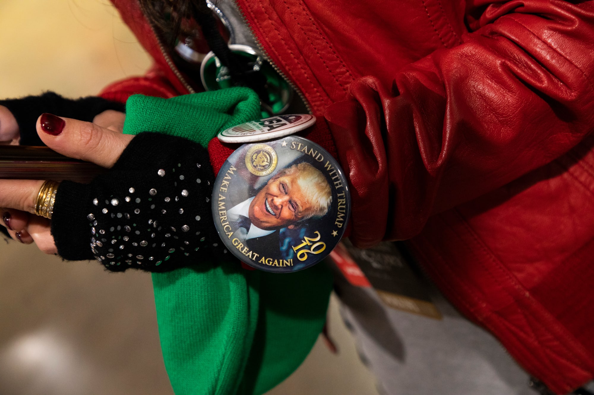 A Donald Trump pin on someone's sleeve