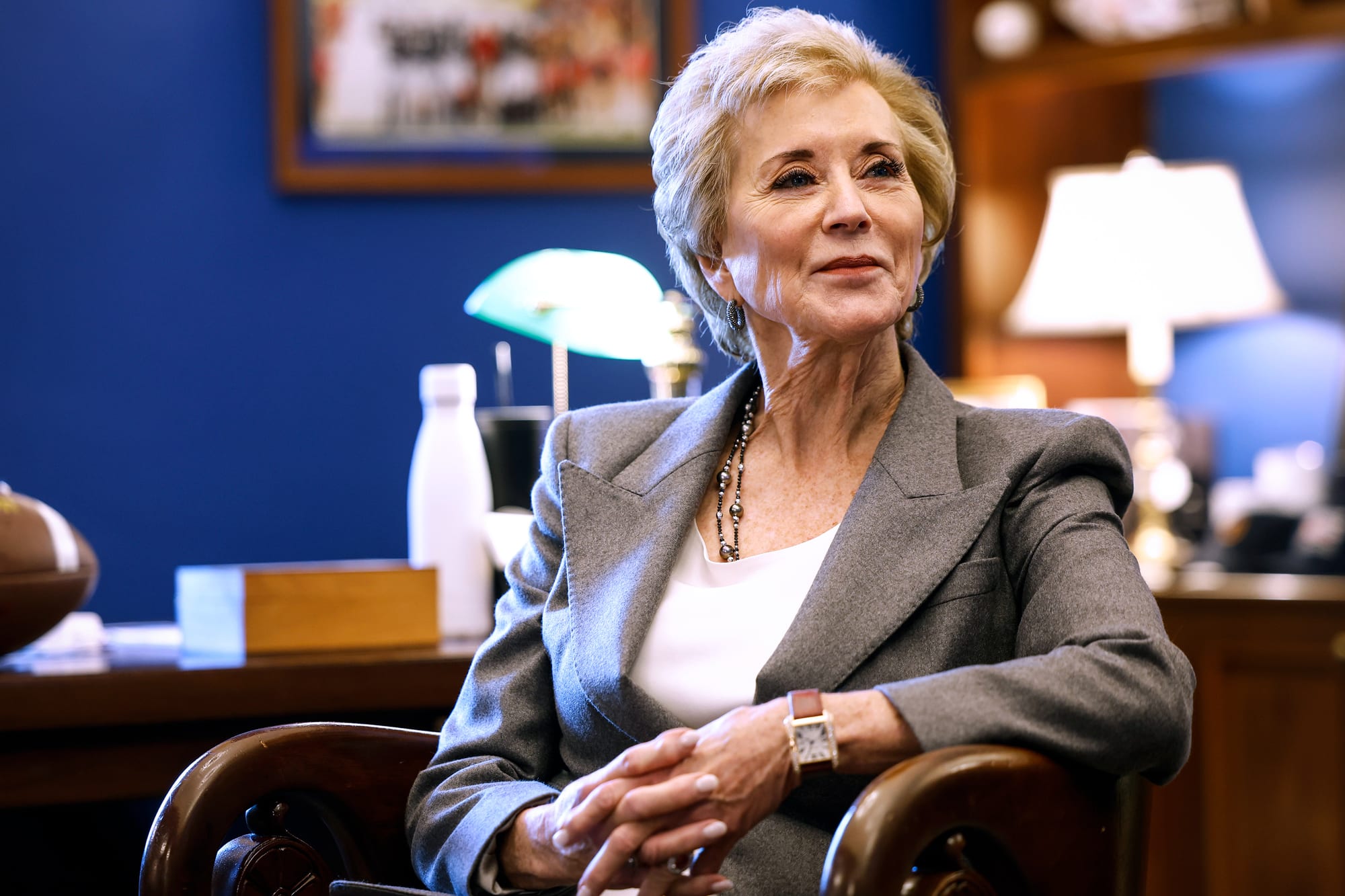 Linda McMahon sits in a chair and smiles