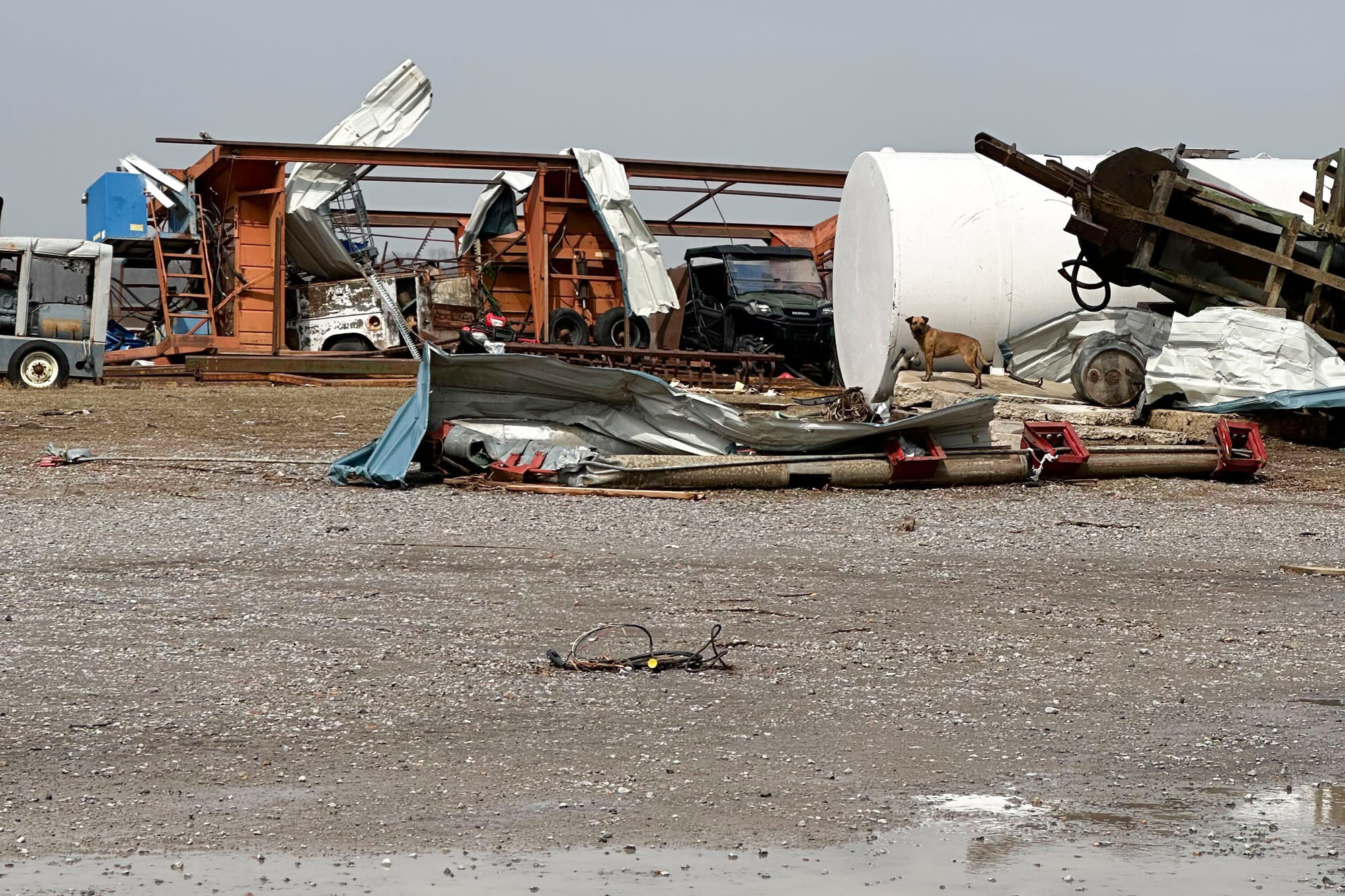 Damaged farm or factory equipment is seen from outside