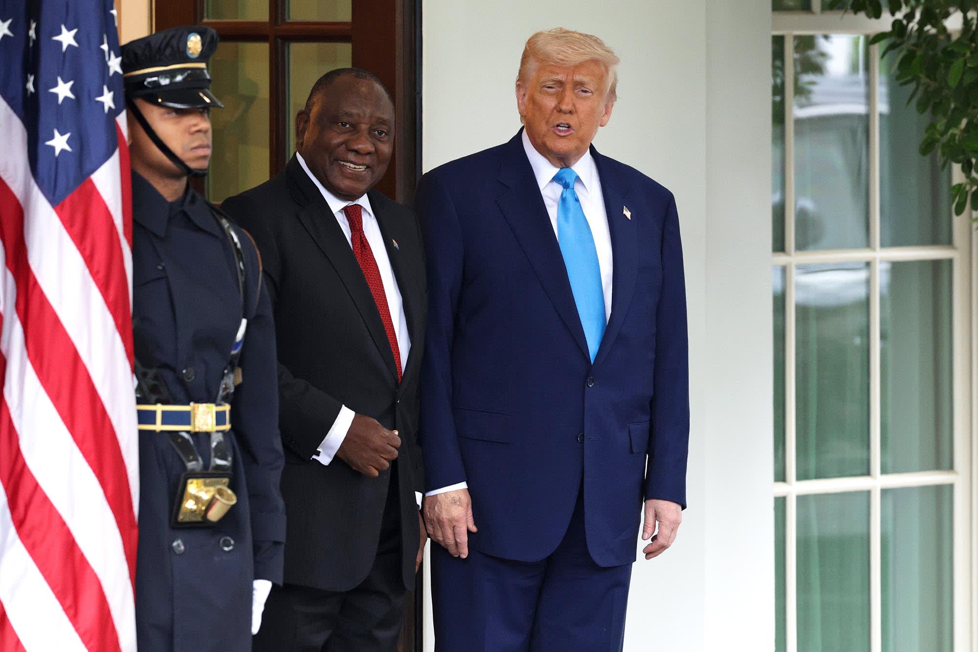 President Donald Trump greets South African President Cyril Ramaphosa at the White House on May 21, 2025.