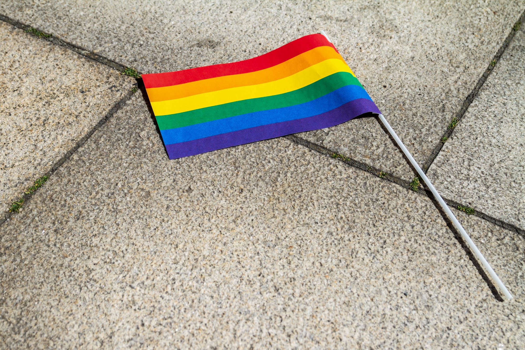 A pride flag on the ground