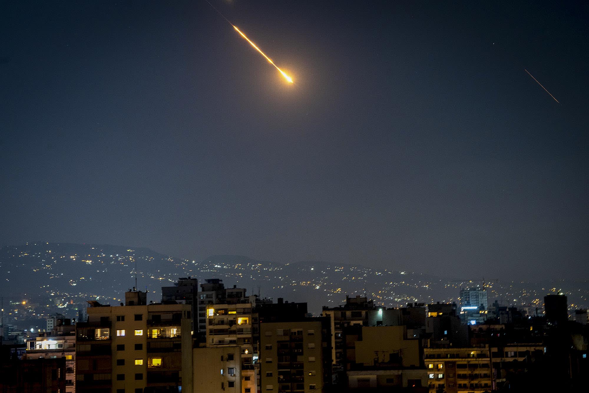 Iranian missiles and Israeli interceptors light up the sky over Beirut, Lebanon, on June 14, 2025. 