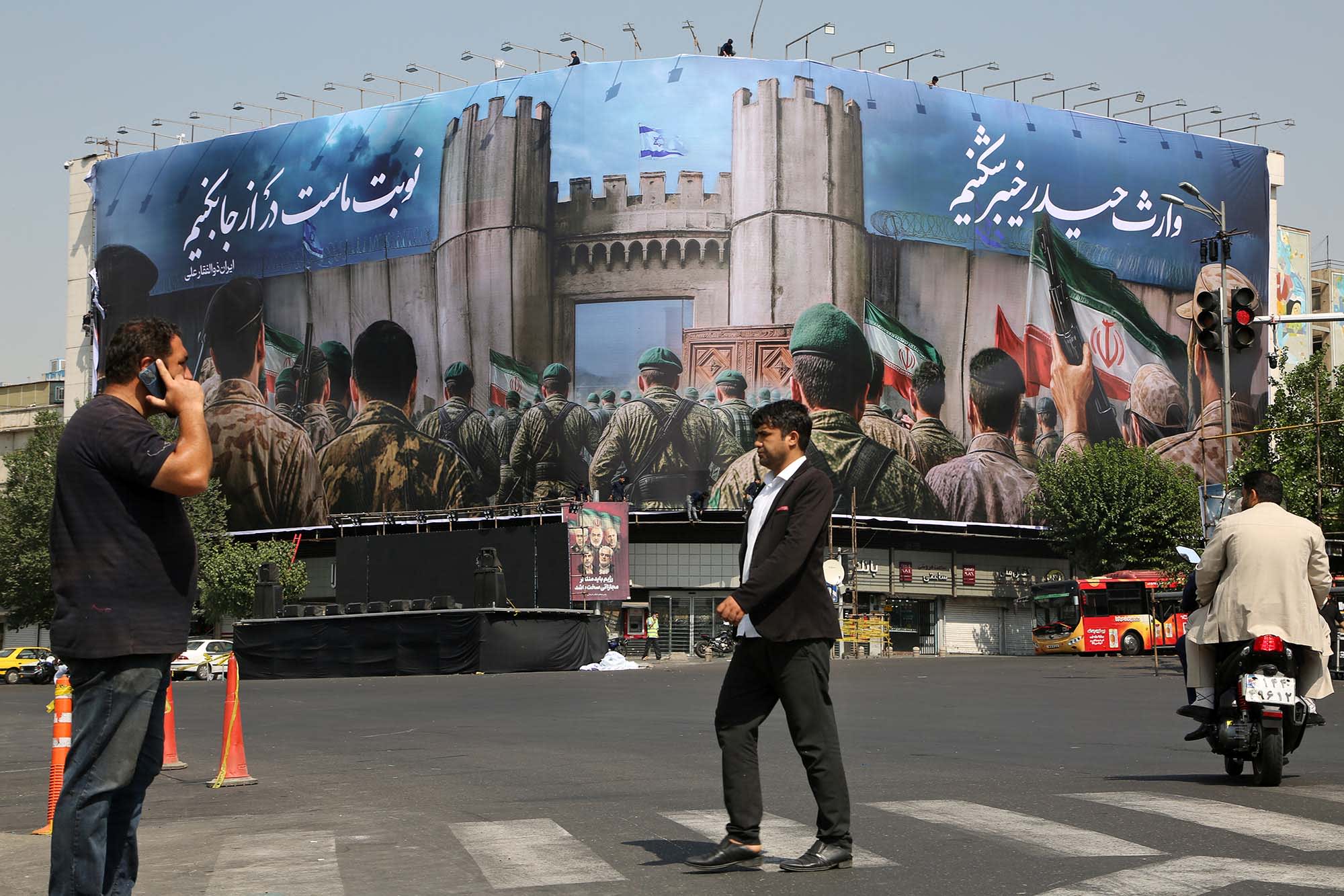 Giant banners hang on buildings in the Iranian capital, Tehran