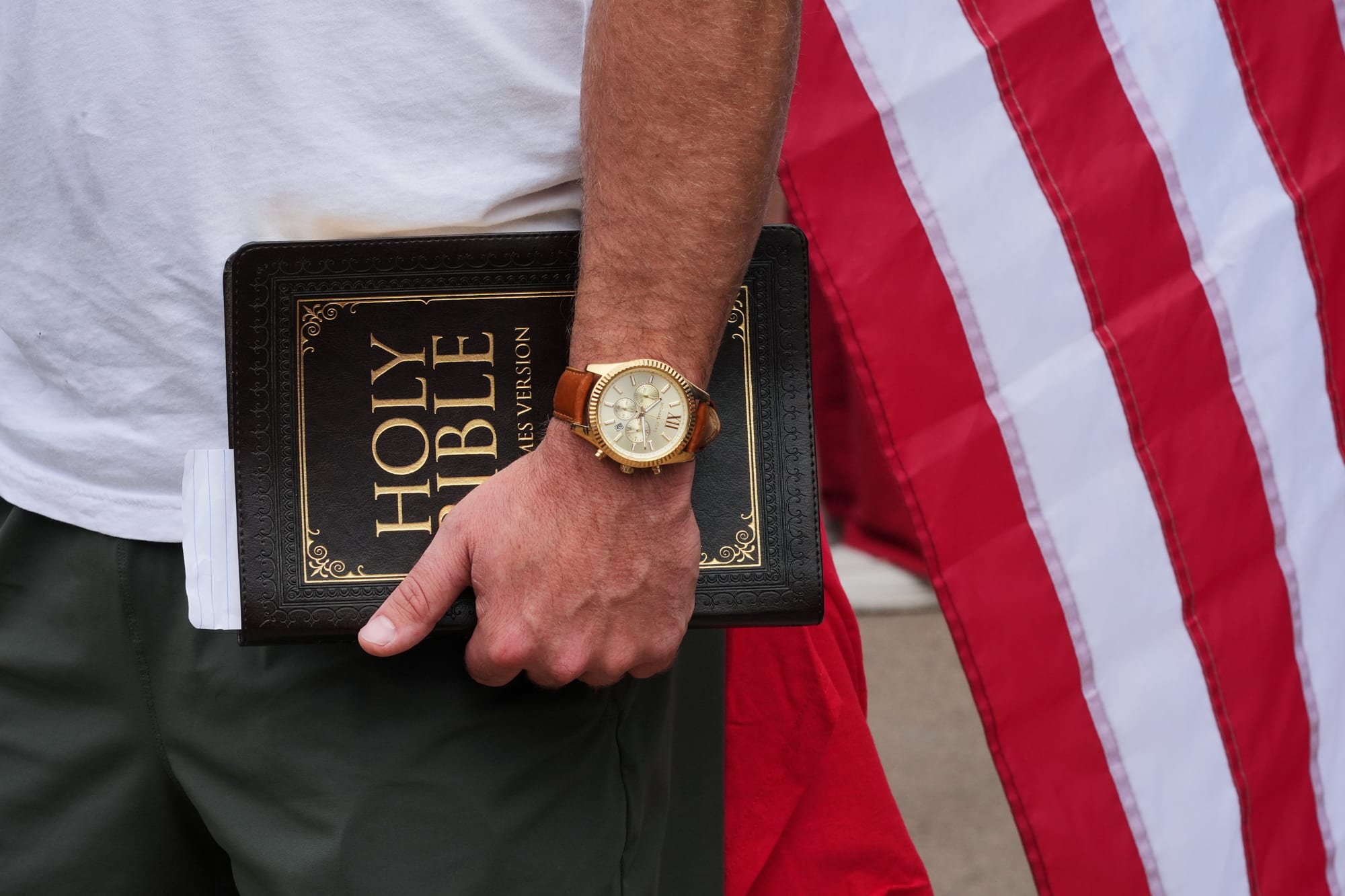 A hand holding a bible