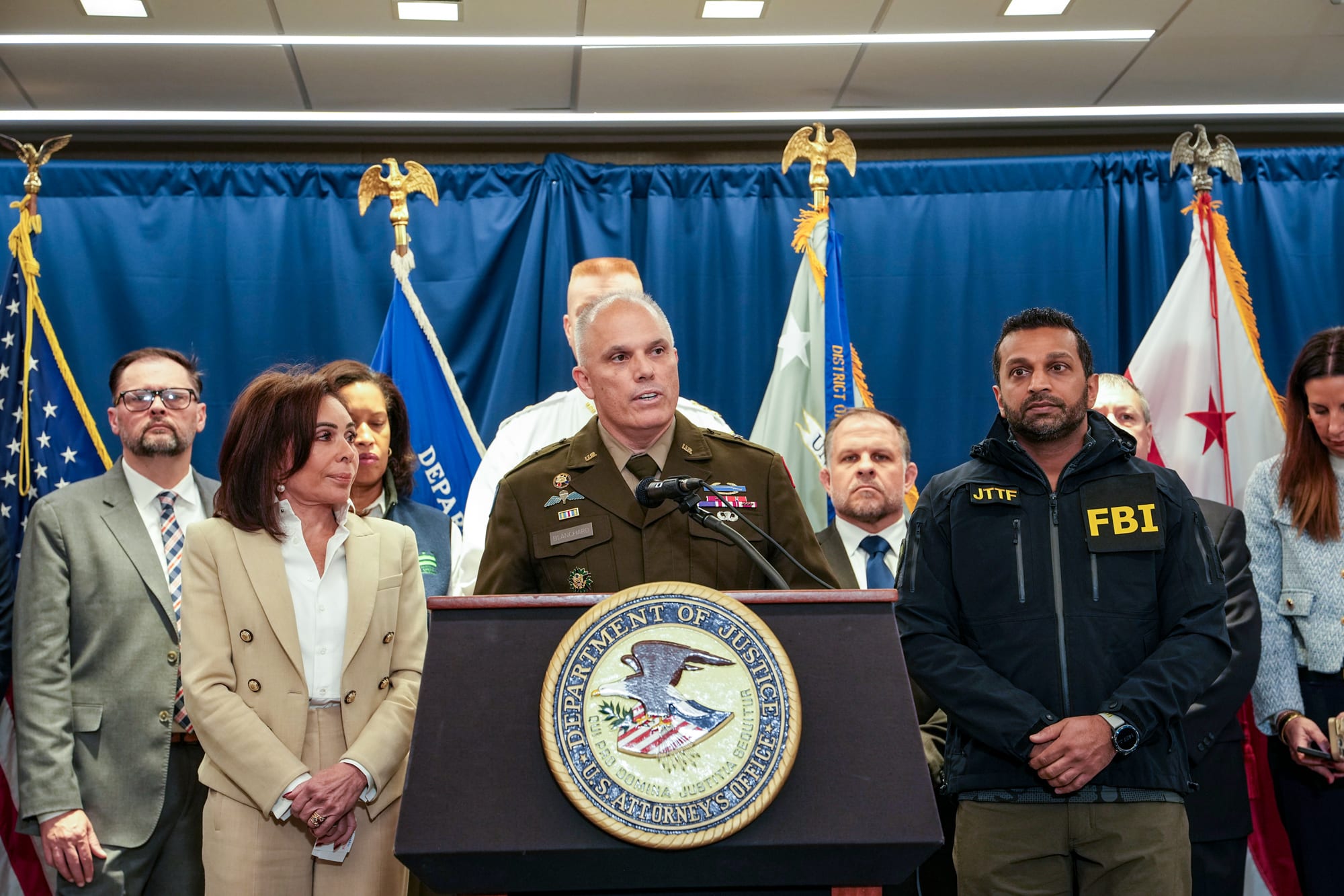 From left, Jeanine Pirro, Leland Blanchard, and Kash Patel during a press conference
