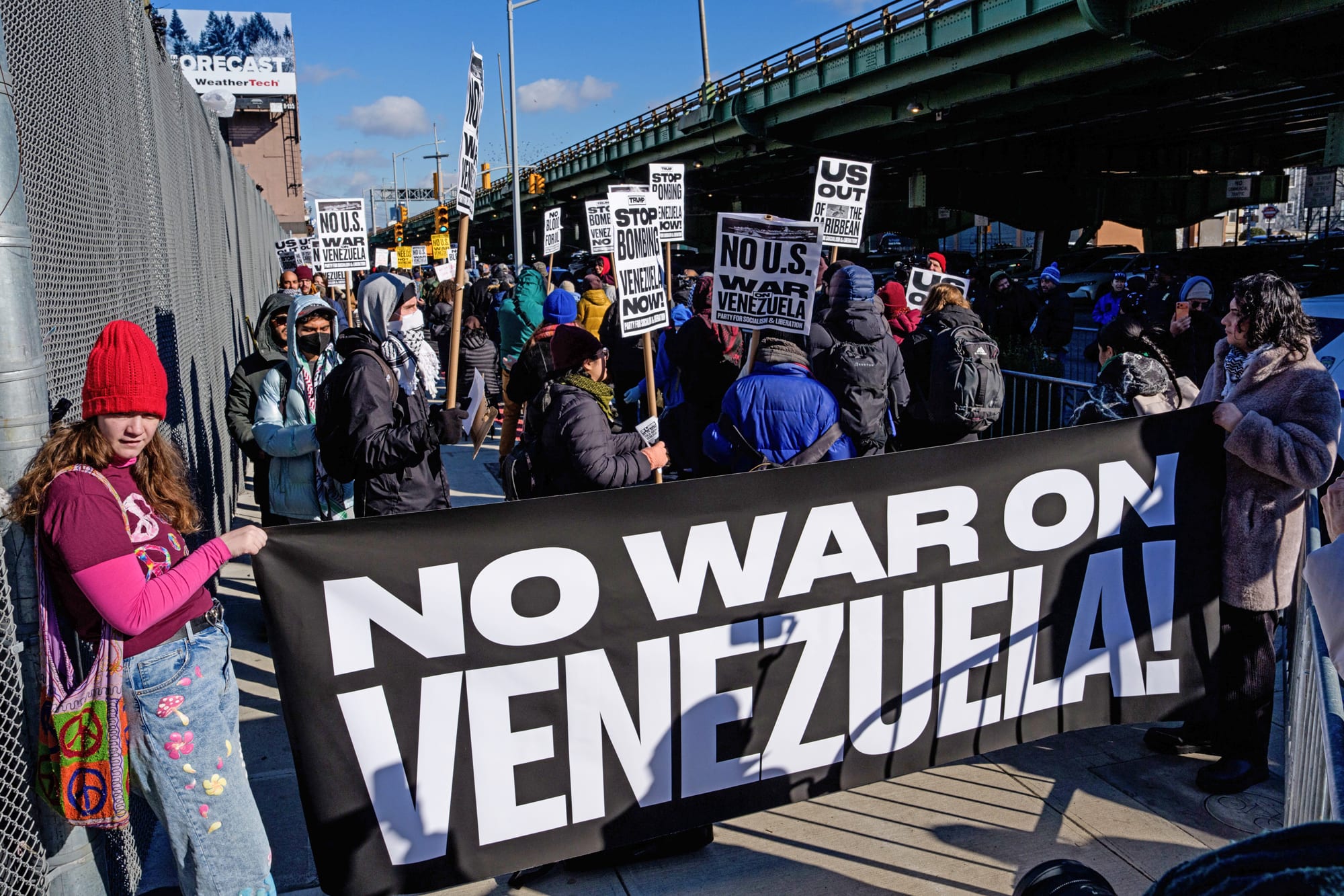 People protest against war in Venezuela outside