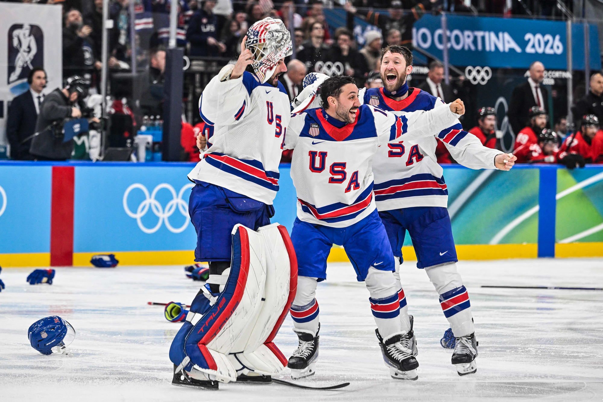 USA hockey players celebrate on the ice