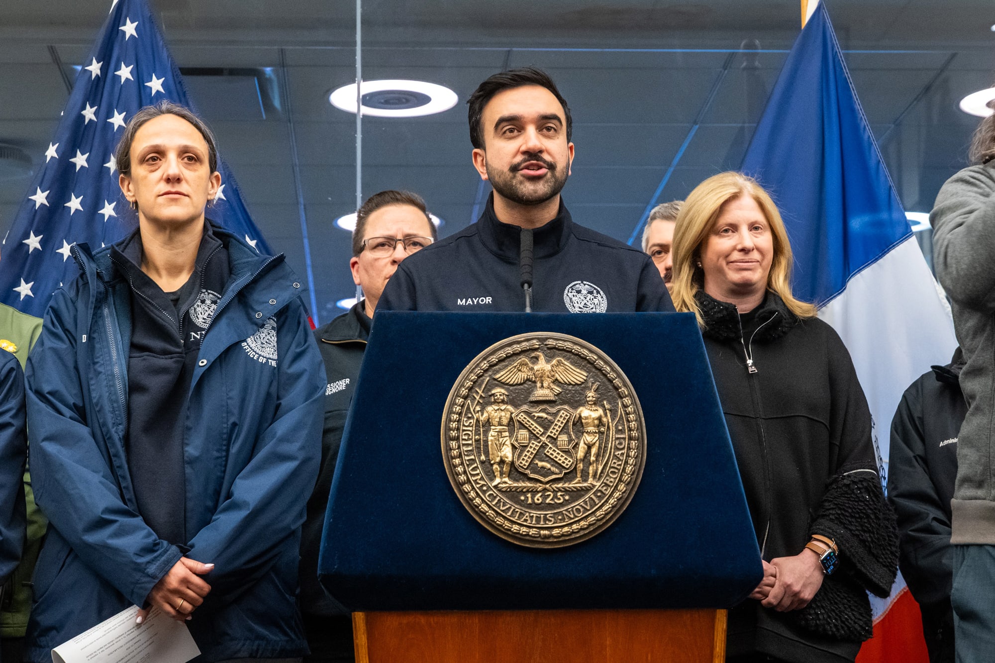 Zohran Mamdani speaks at a podium
