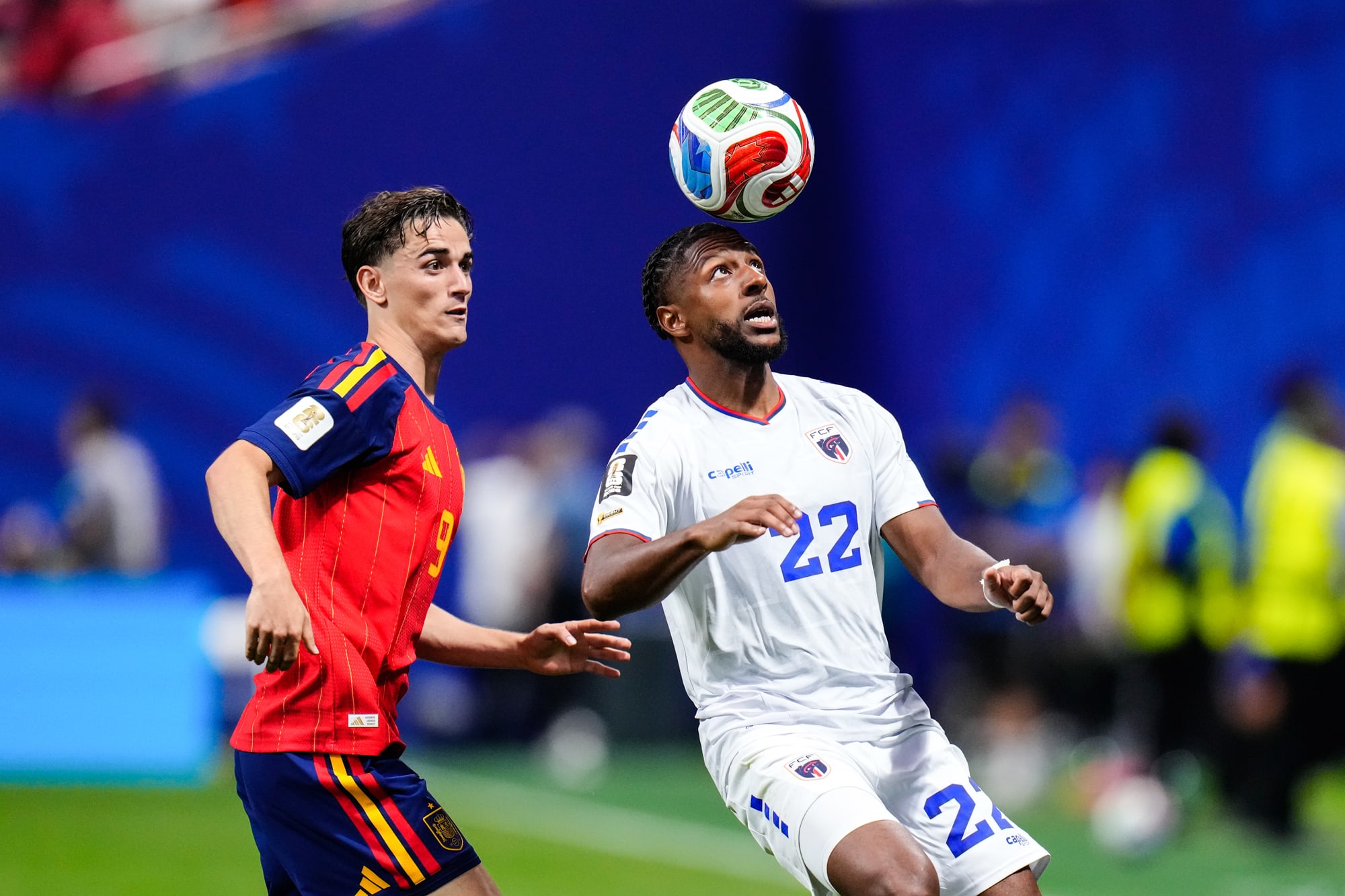 Pablo Martin Gavi of Spain, left, and Steven Moreira of Cape Verde compete for the ball in the air above their heads