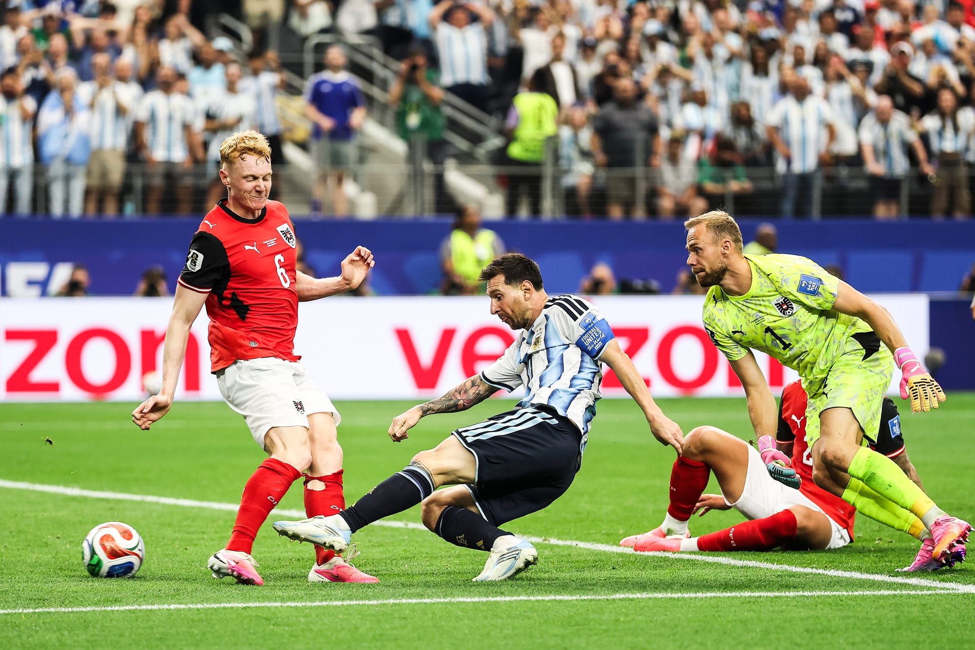 Lionel Messi kicks a ball on the soccer field