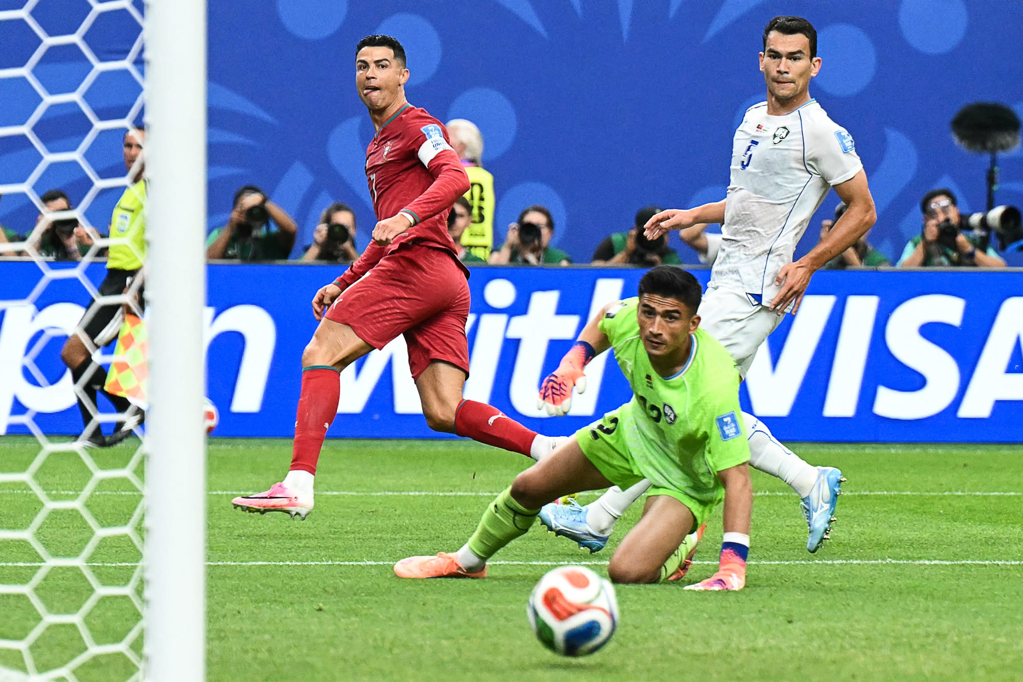 Cristiano Ronaldo reacts as he scores his team's third goal