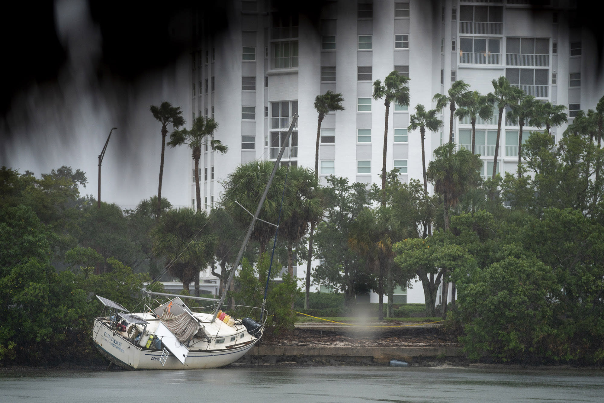 A boat run aground from a previous storm