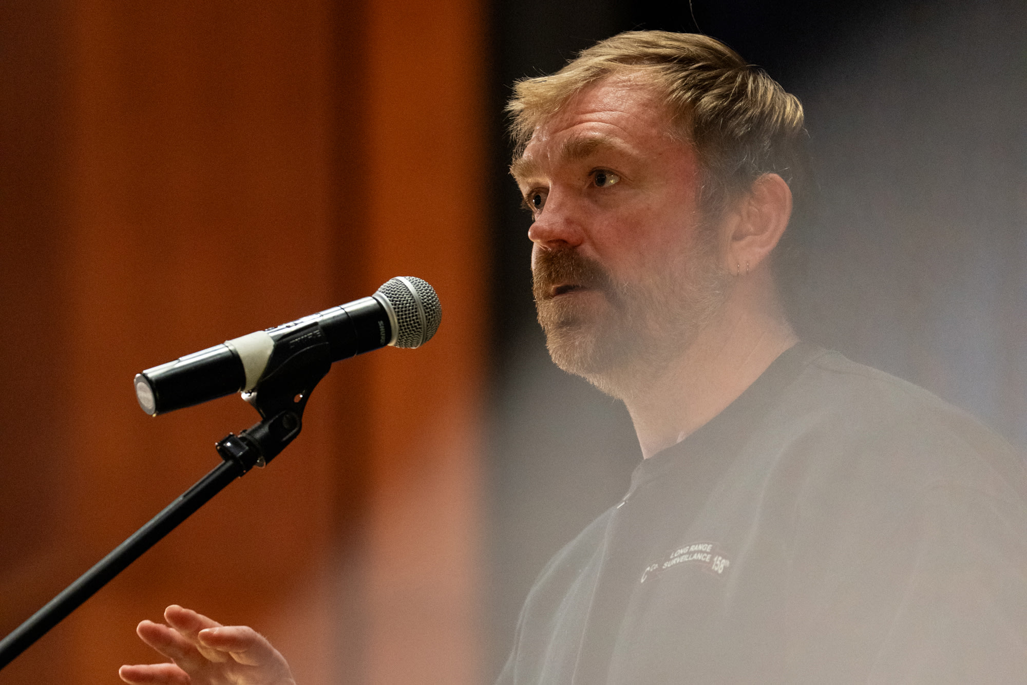 Graham Platner speaks into a microphone