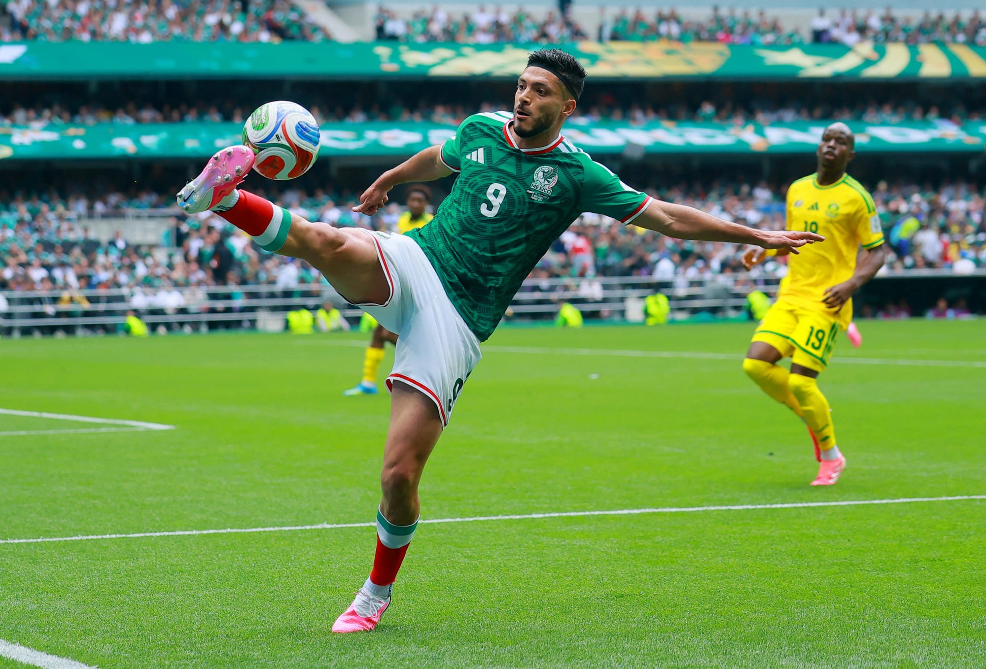 Reul Jimenez kics the ball on the soccer field
