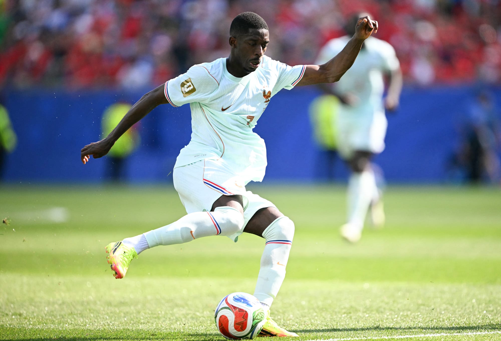 Ousmane Dembele controls the ball on the soccer field