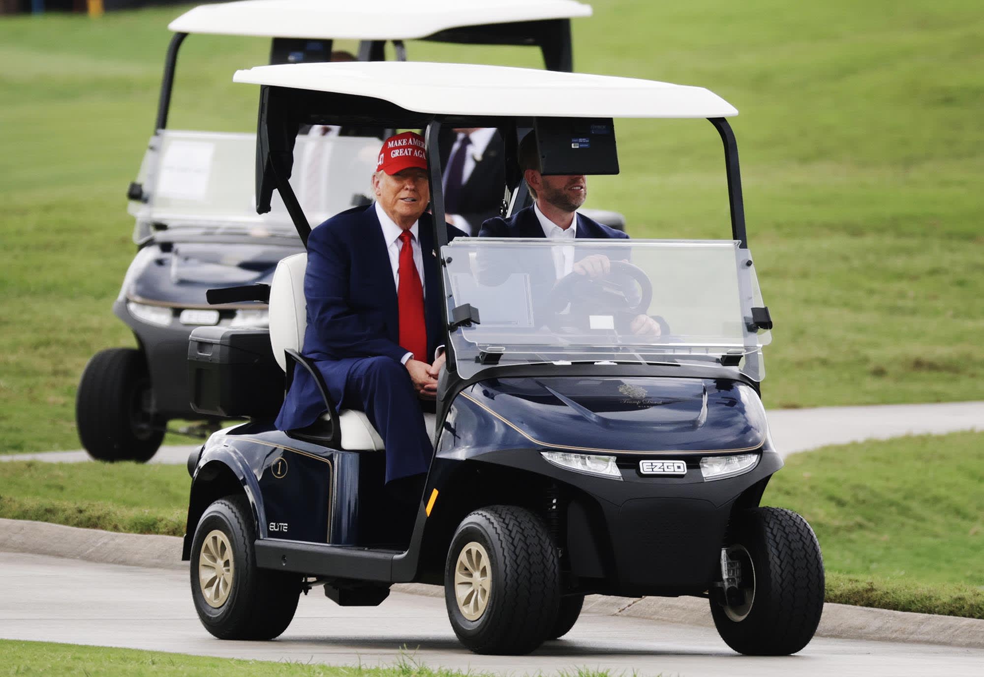 President Donald Trump and his son, Eric Trump, after he arrived at the LIV Golf tournament at his Trump National Doral Golf Club on April 3, 2025 in Doral, Fla.