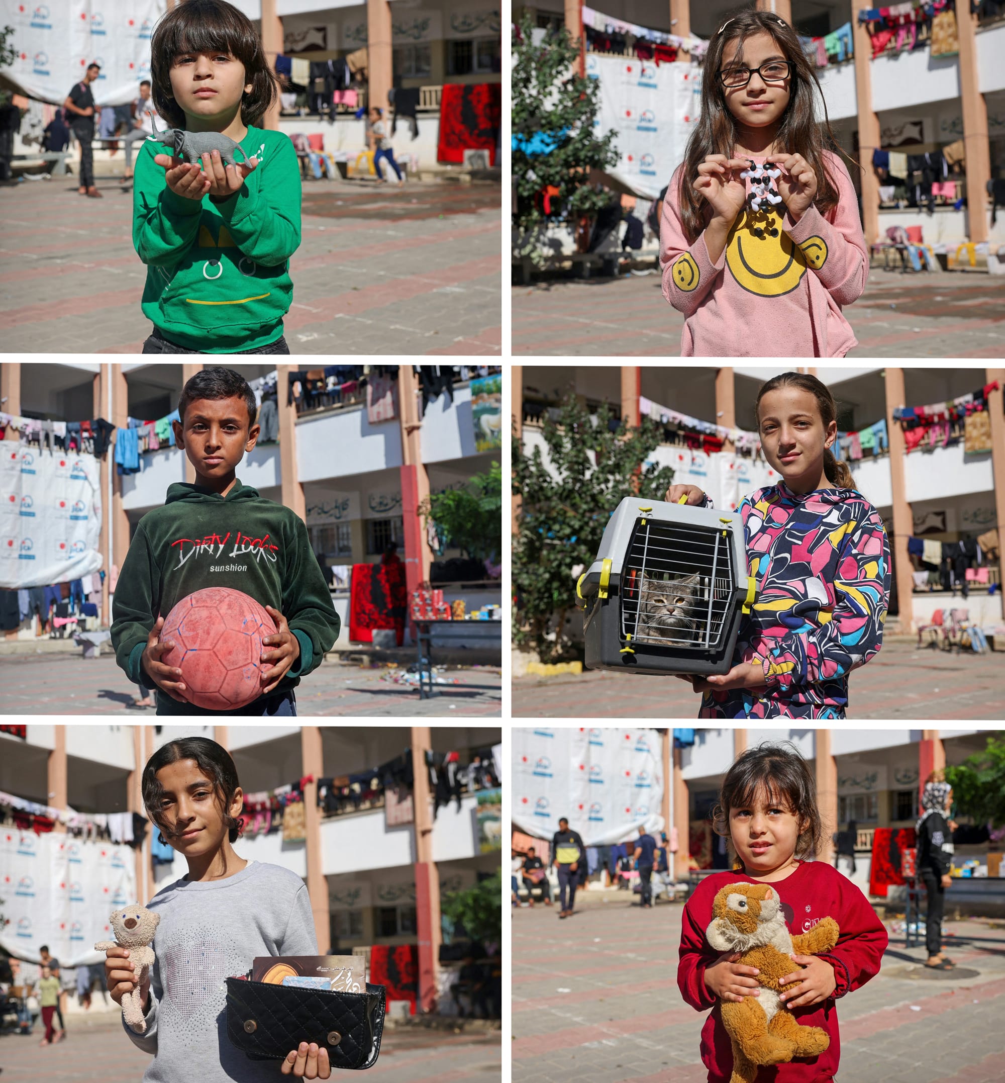 Palestinian children pose in the courtyard of a government-run school in Rafah, southern Gaza Strip, holding something they took with them when they fled northern Gaza.