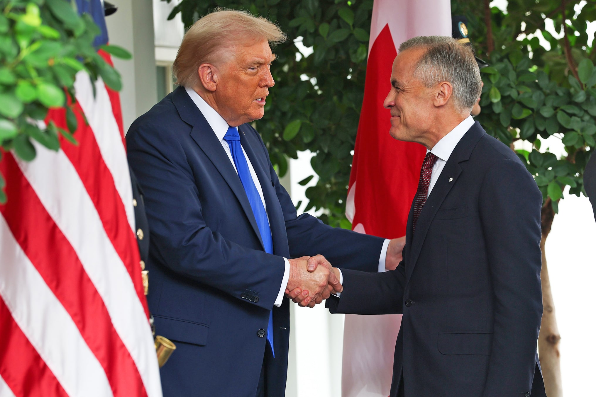 President Donald Trump (L) welcomes Canadian Prime Minister Mark Carney outside the West Wing of the White House on October 07, 2025.