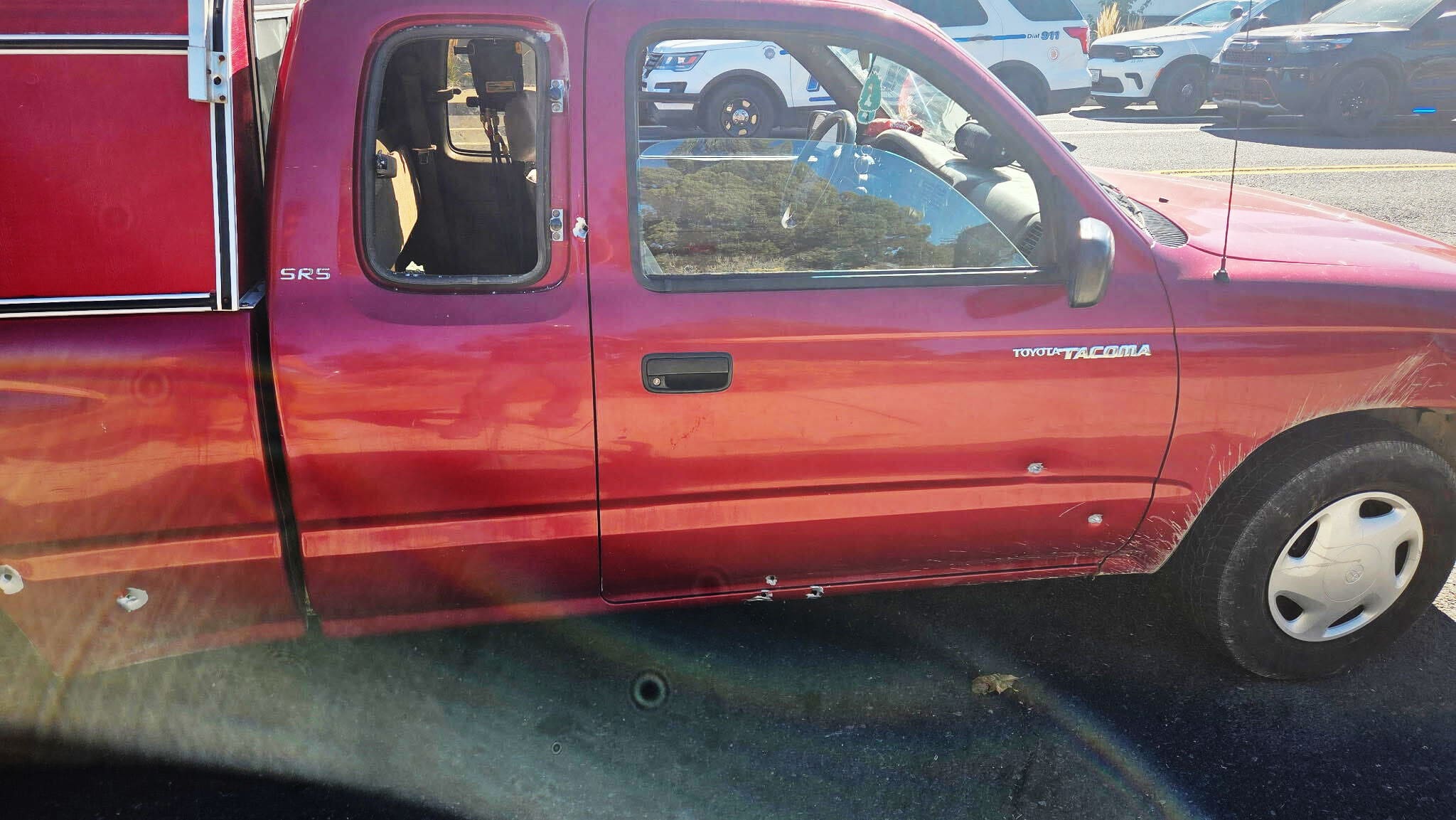 Bullet holes in a truck outside Silver Rail Elementary School
