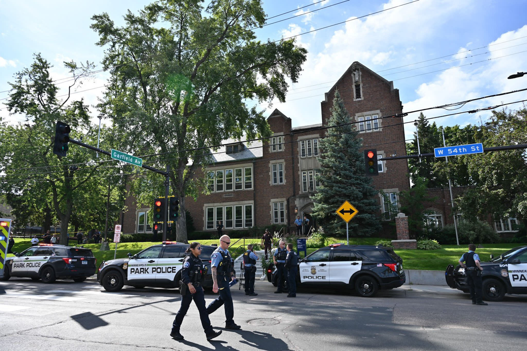 Police and first responders work at the scene of a shooting near Annunciation Church and Catholic School in Minneapolis, Minneosta, on August 27, 2025. 
