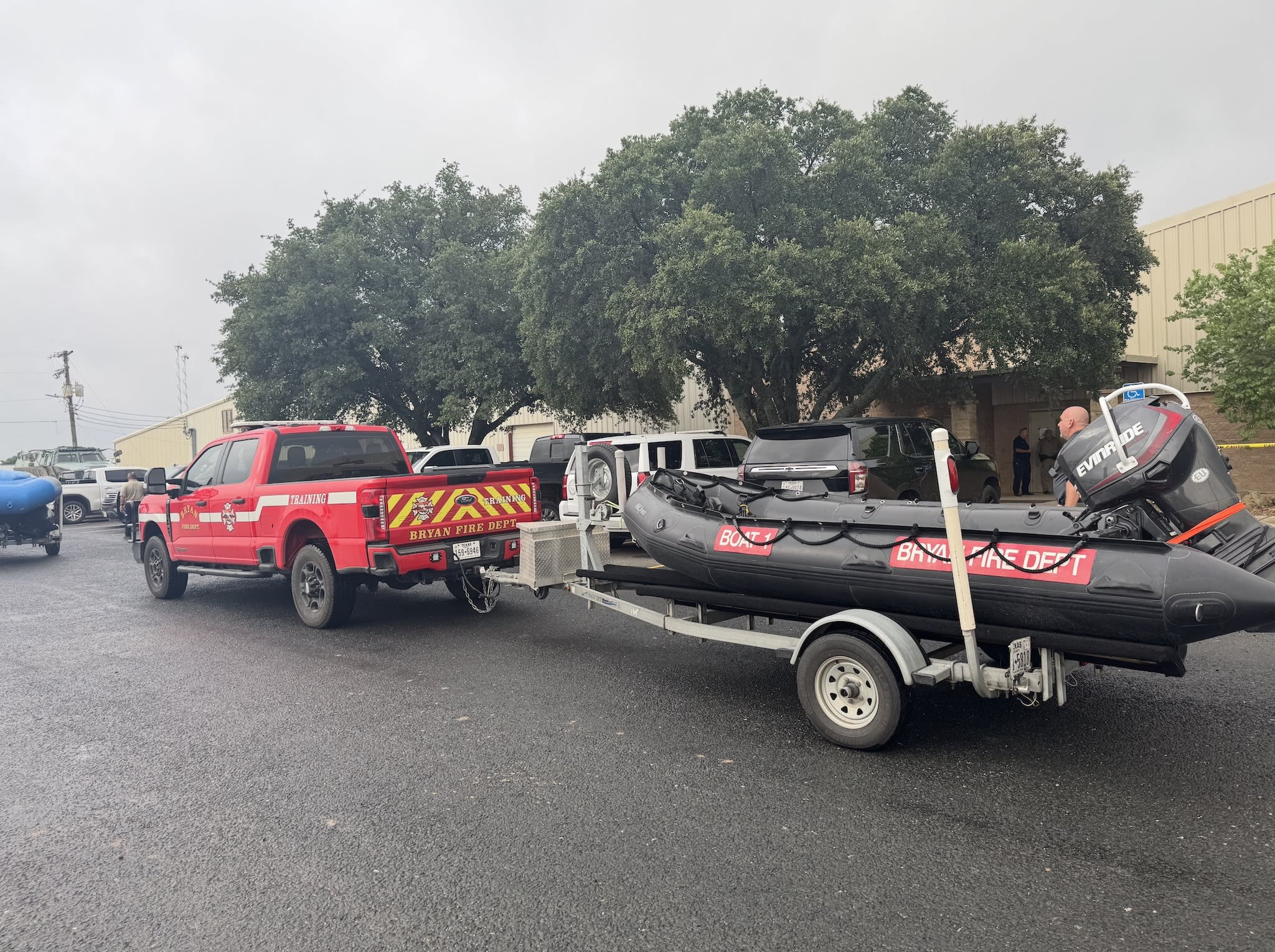 A police truck carrying a boat behind it