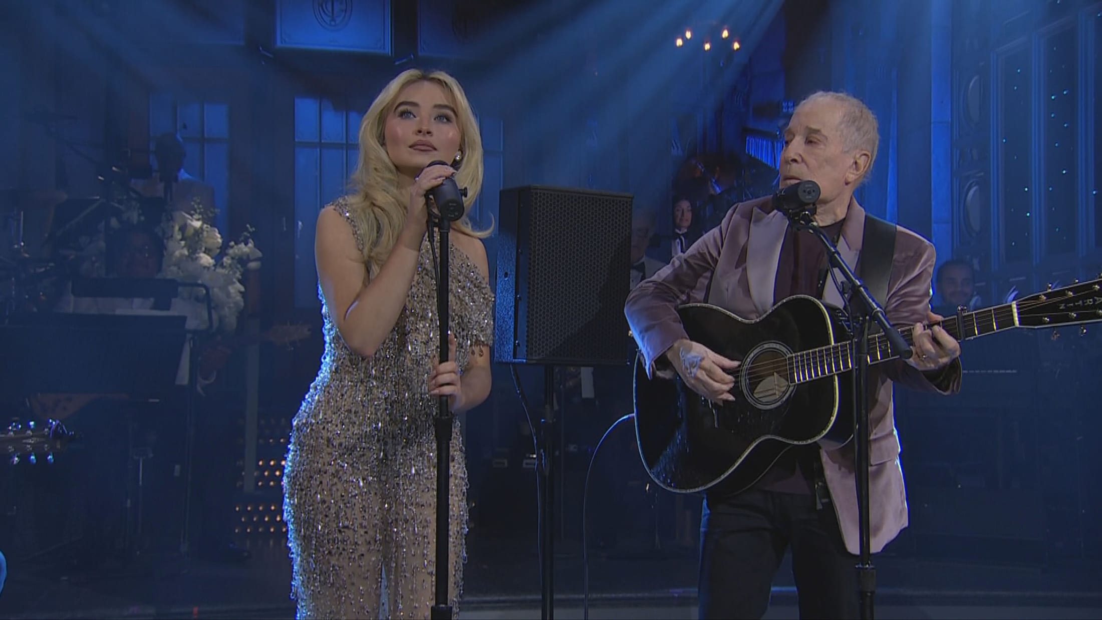 Sabrina Carpenter and Paul Simon preform at SNL50.