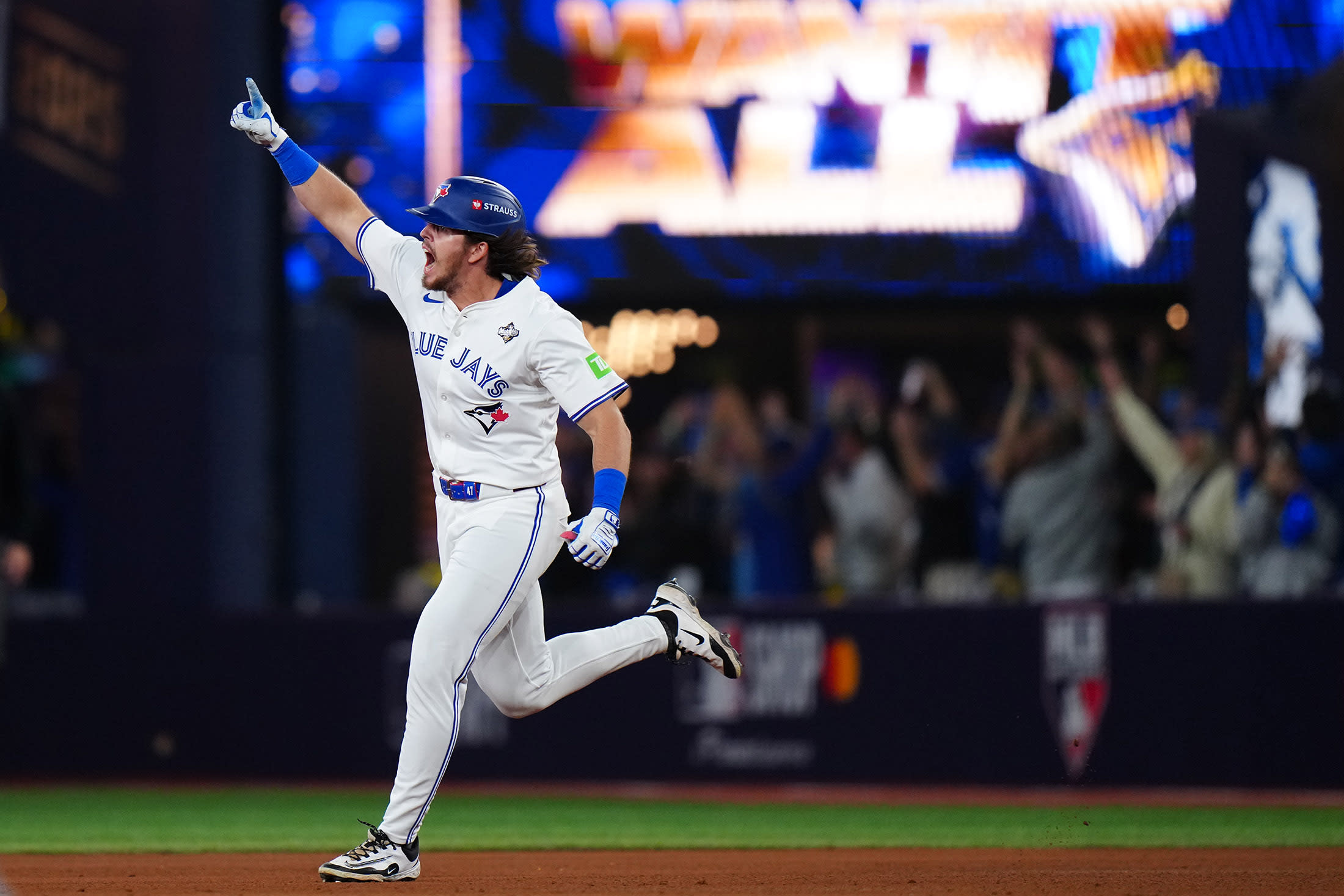 Addison Barger of the Toronto Blue Jays rounds the bases.