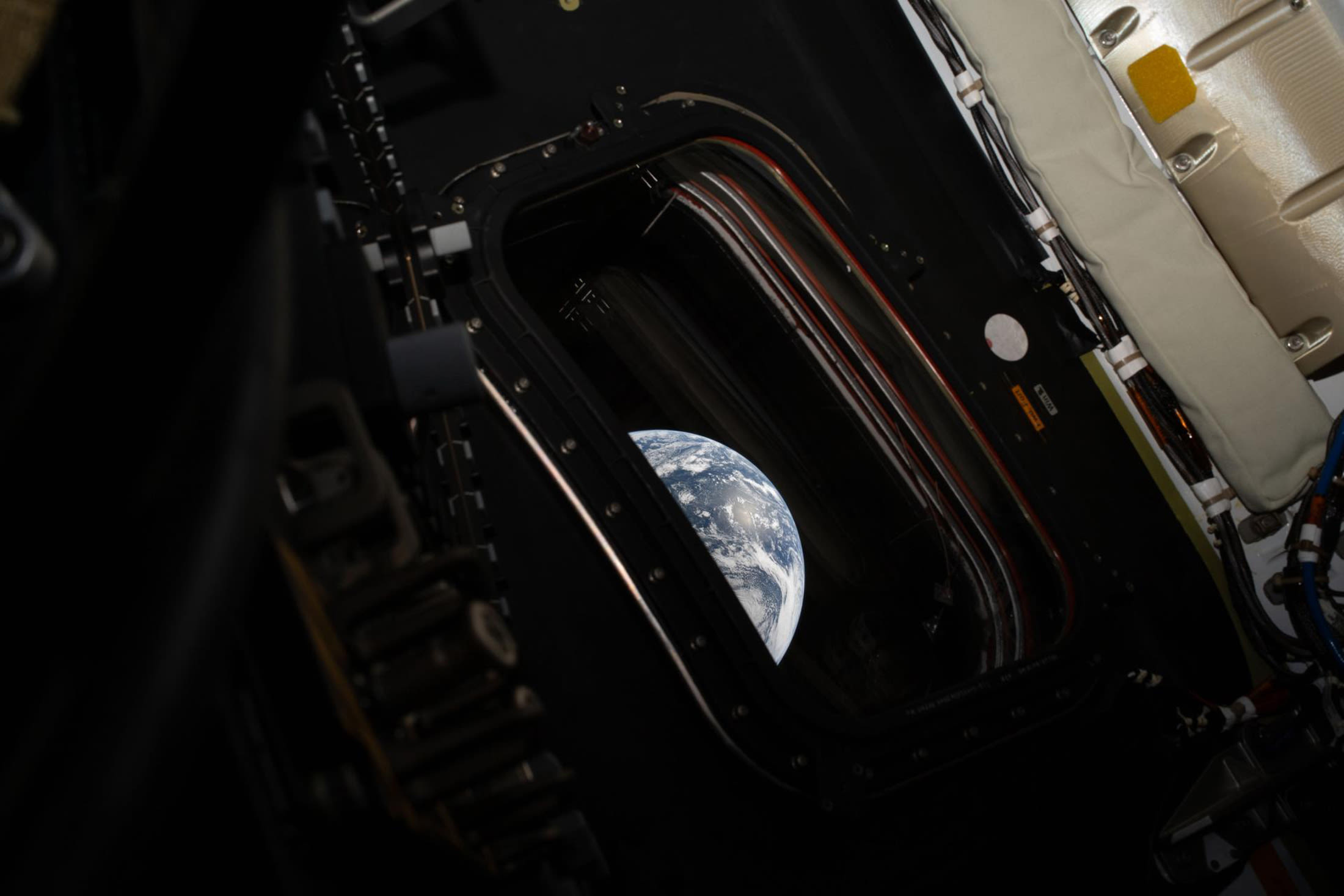 A view of Earth taken by NASA astronaut and Artemis II commander Reid Wiseman from one of the Orion spacecraft's four main windows after completing the translunar injection burn on April 2, 2026.