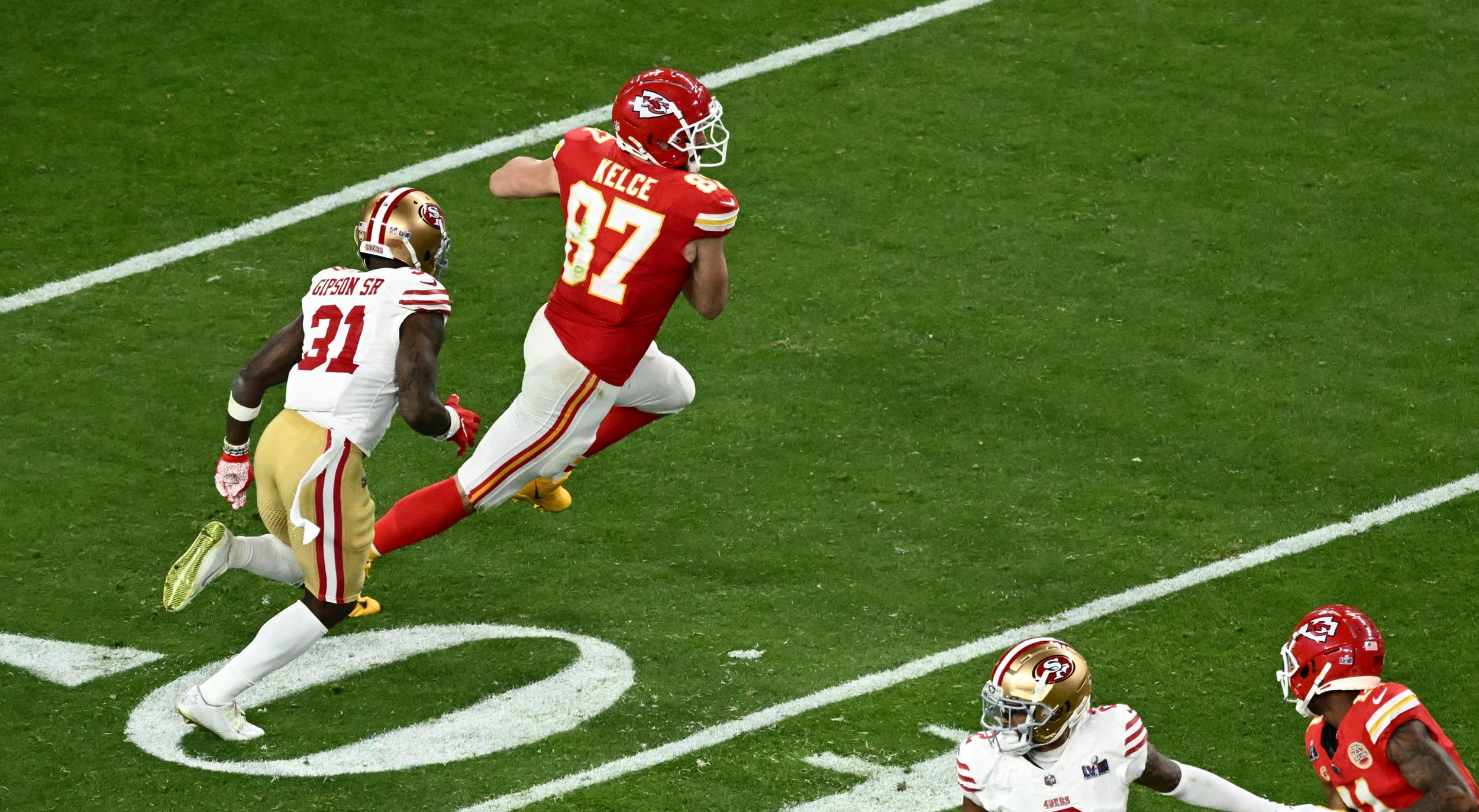 Kansas City Chiefs' tight end #87 Travis Kelce runs with the ball during Super Bowl LVIII between the Kansas City Chiefs and the San Francisco 49ers at Allegiant Stadium in Las Vegas, Nevada, February 11, 2024.