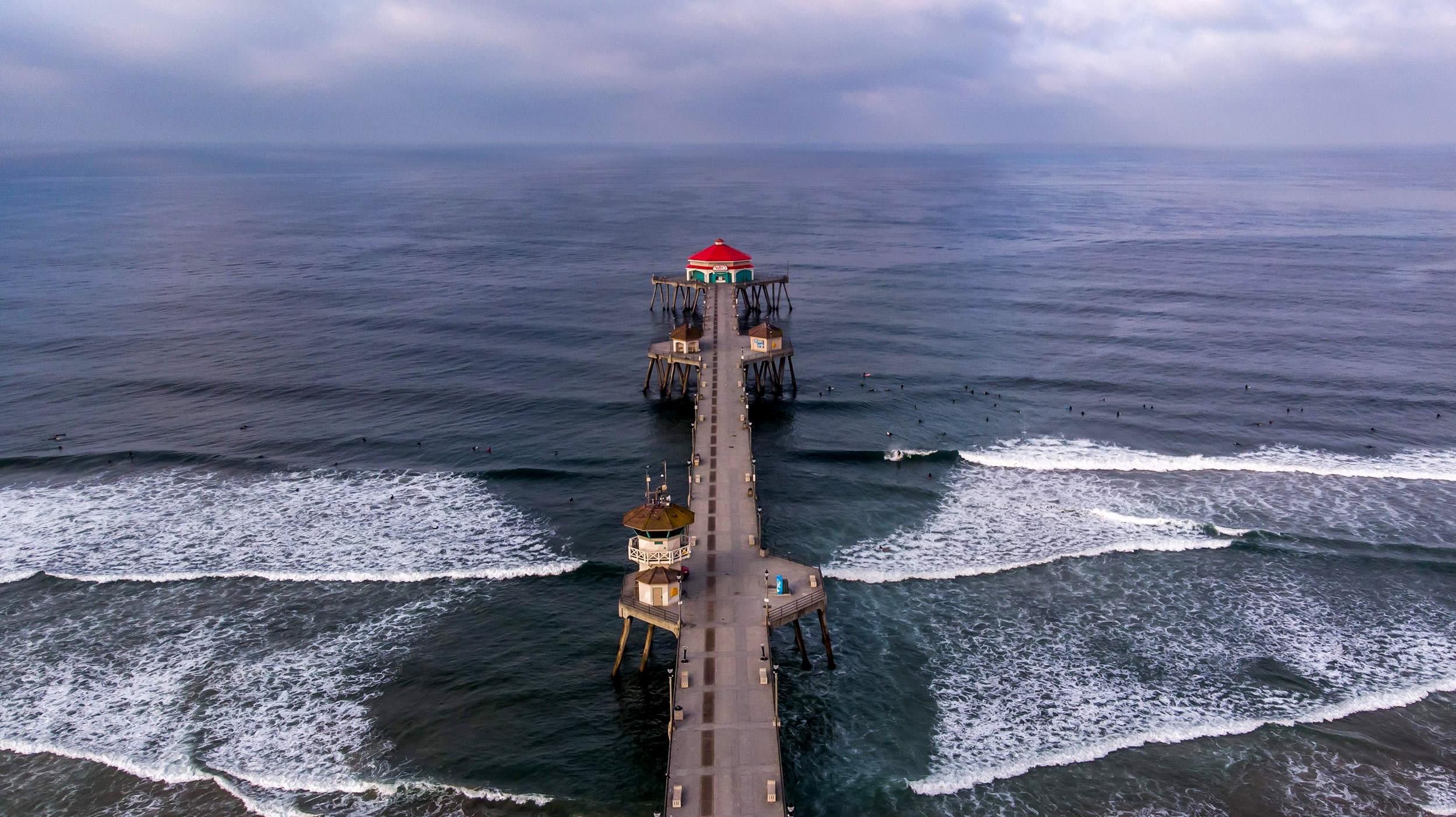 Image: California's Huntington Beach pier is closed on May 2, 2020. Orange County beaches will remain closed after a judge rejected bids by Dana Point and Huntington Beach officials to lift Governor Gavin Newsom's temporary closure to curb the spread of c