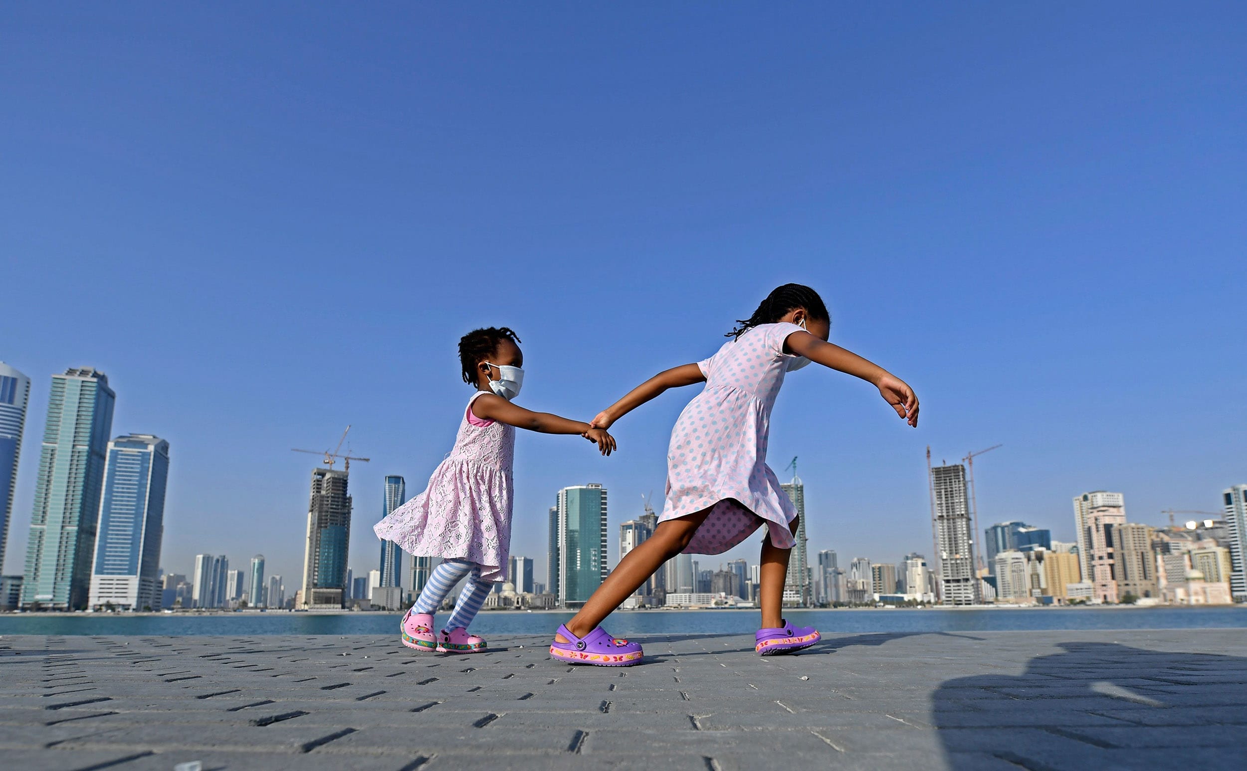 Image: A girl, wearing a face mask due to the coronavirus pandemic in Dubai. 