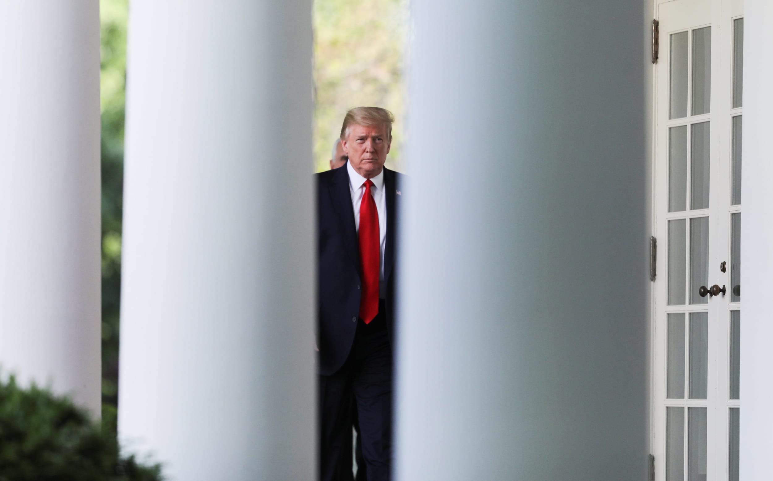 Image: U.S. President Trump arrives for coronavirus response news conference at the White House in Washington