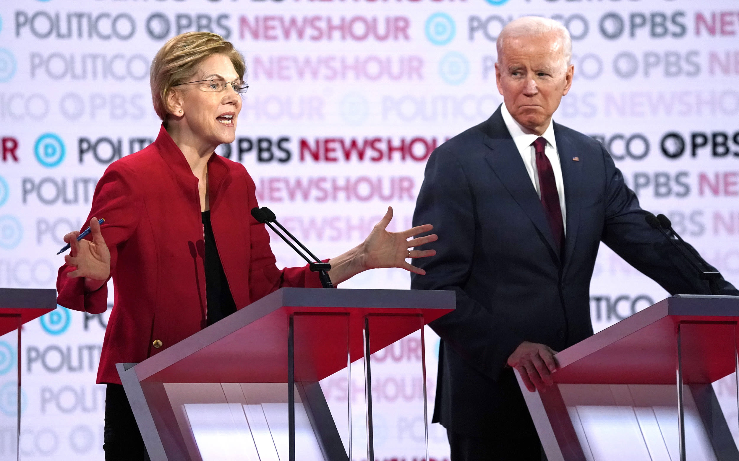 Image: Democratic U.S. presidential candidate Senator Elizabeth Warren speaks with former Vice President Joe Biden listening during the sixth Democratic presidential candidates campaign debate at Loyola Marymount University in Los Angeles