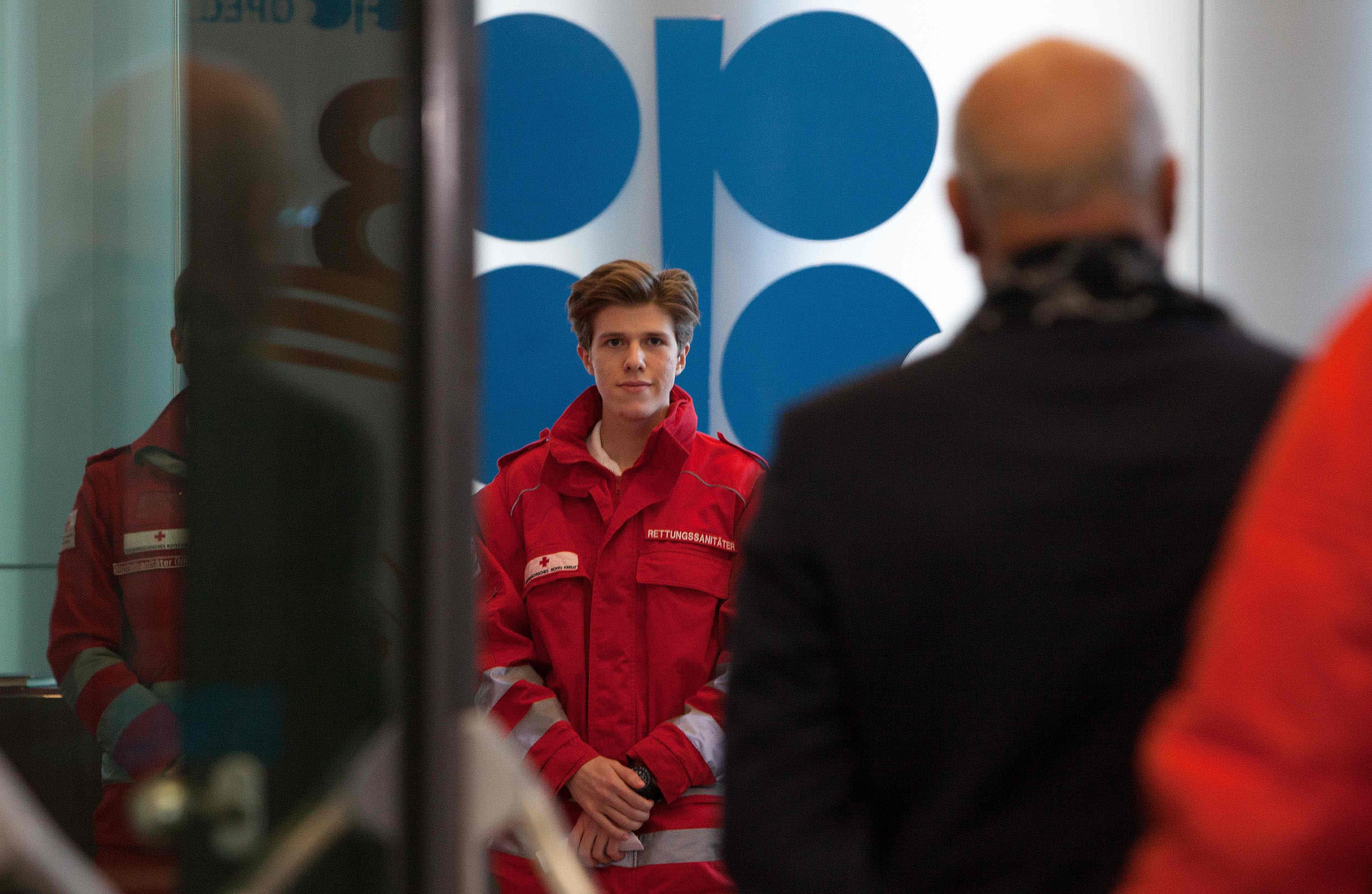 Image: Red Cross medics check the temperature of participants of the 178th Organization of Petroleum Exporting Countries (OPEC) meeting in Vienna, Austria