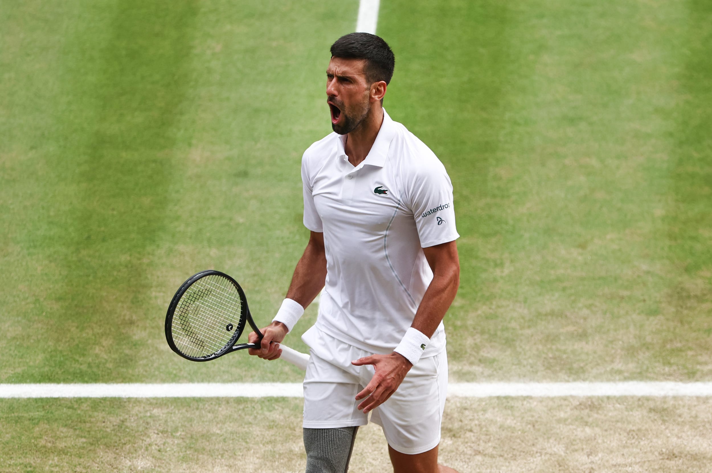 Novak Djokovic of Serbia reacts as he plays against Carlos Alcaraz