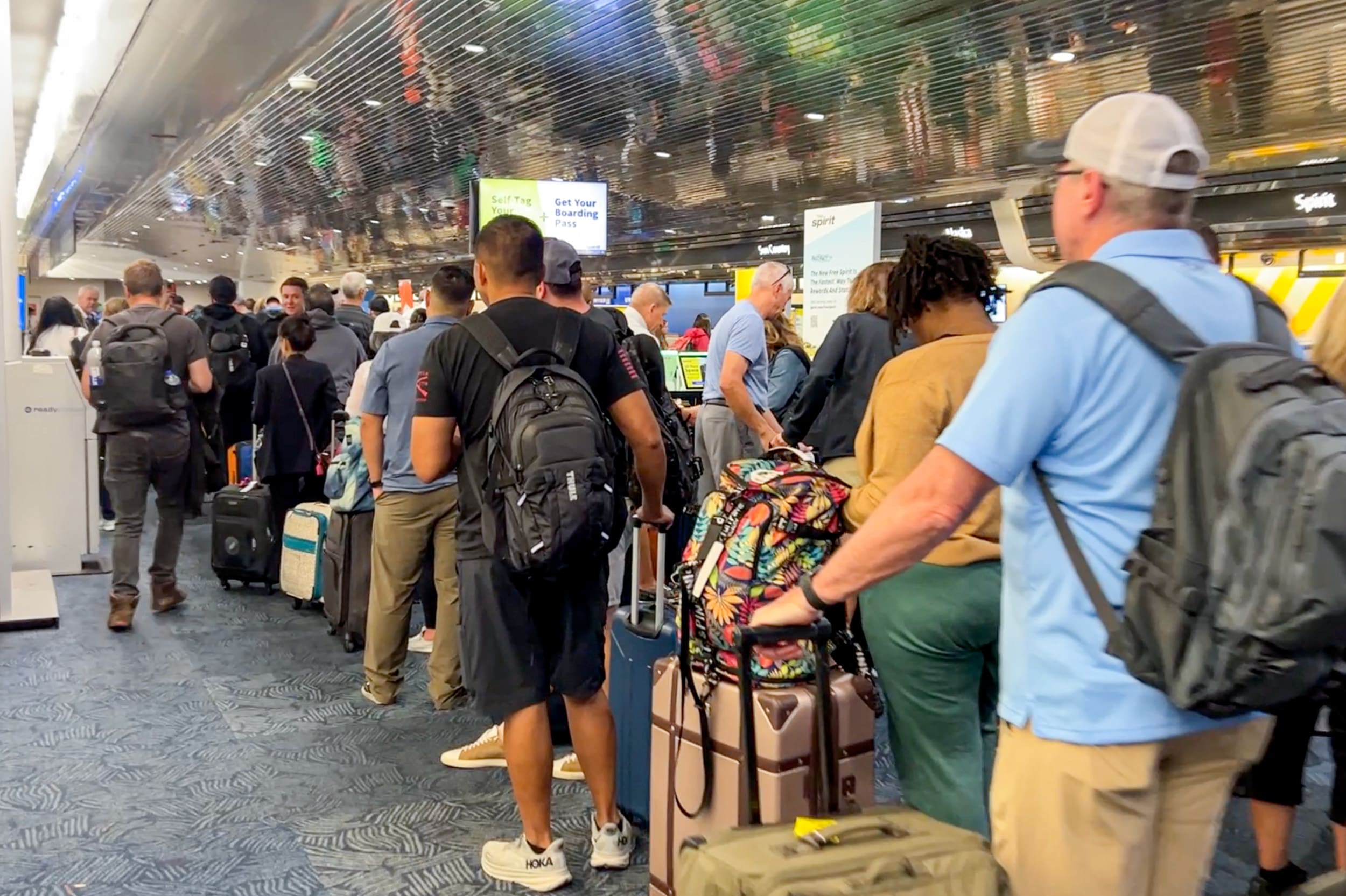 People in line at the airport check-in area.