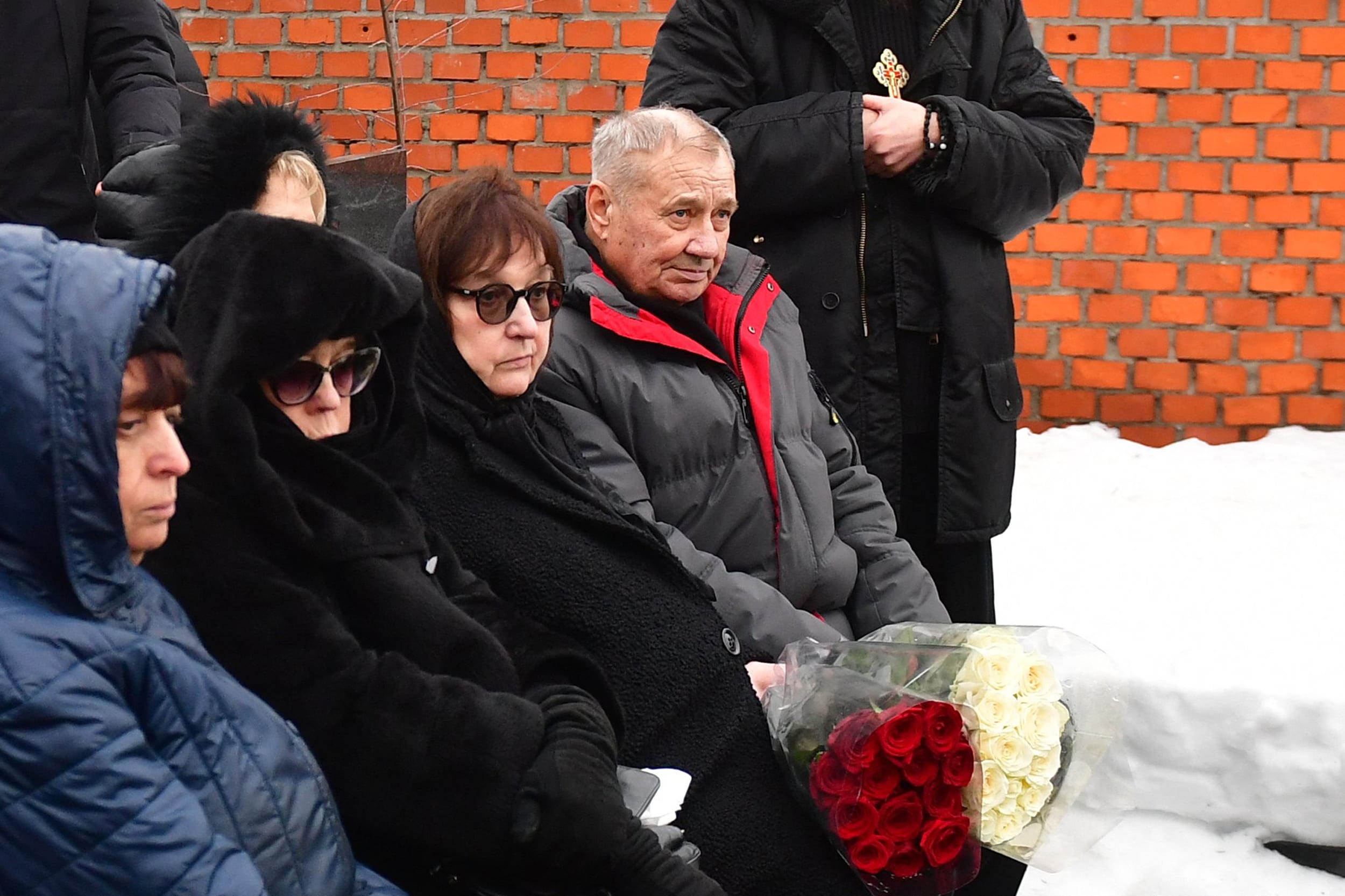 Lyudmila Navalnaya, second right, and Anatoly Navalny, right,, parents of late Russian opposition leader Alexei Navalny, attend the funeral ceremony for their son at the Borisovo cemetery in Moscow