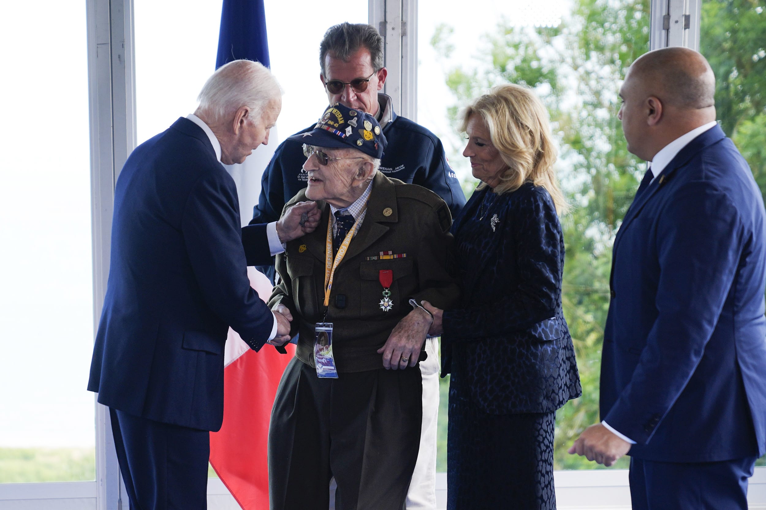 President Joe Biden and first lady Jill Biden, greet a World War II veteran during ceremonies to mark the 80th anniversary of D-Day on June 6, 2024, in Normandy. 