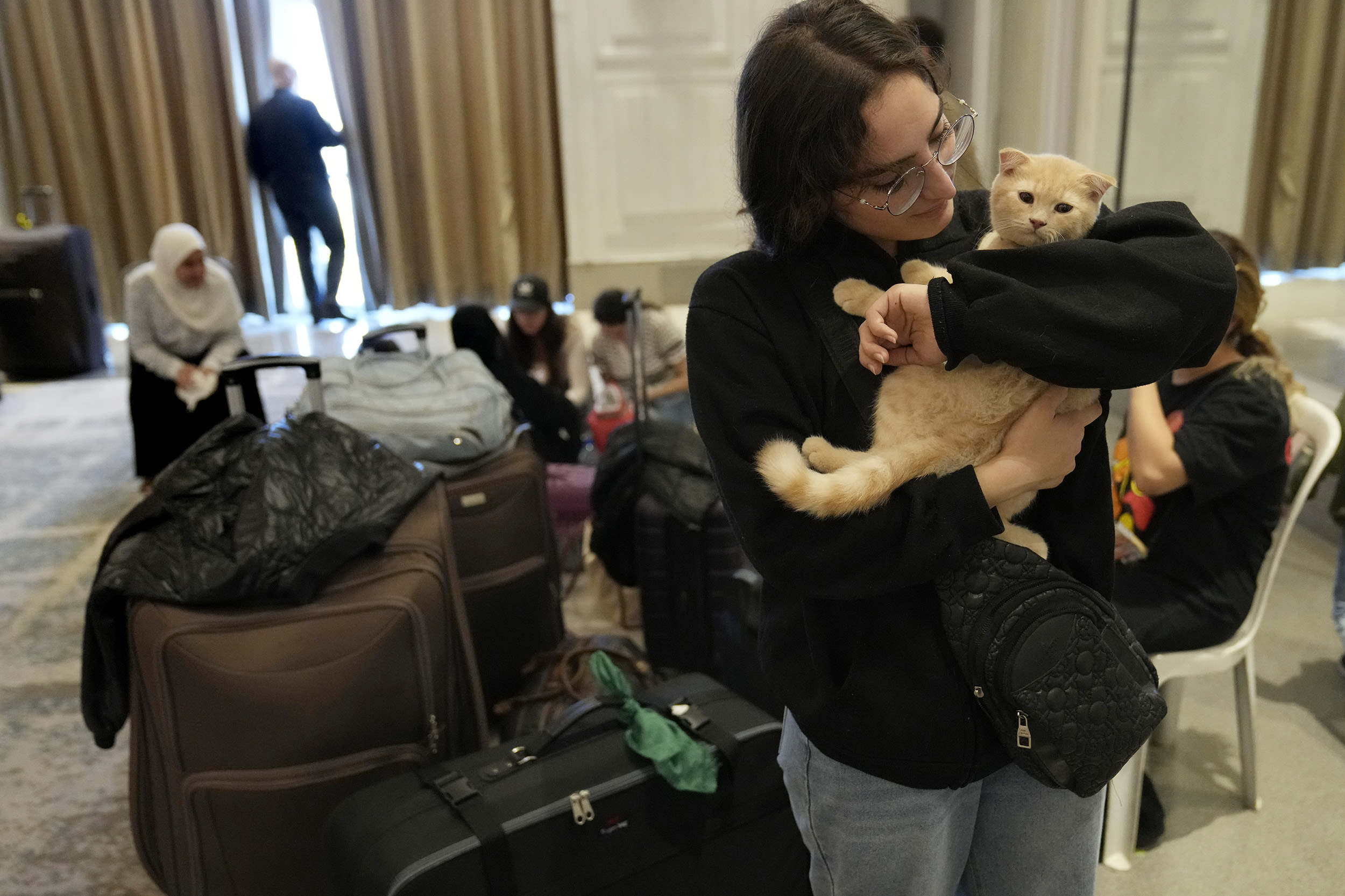 Turkish passport holders gather near a hotel on Beirut's waterfront, ahead of their evacuation from Lebanon on Turkish Navy ships on Oct. 9, 2024.