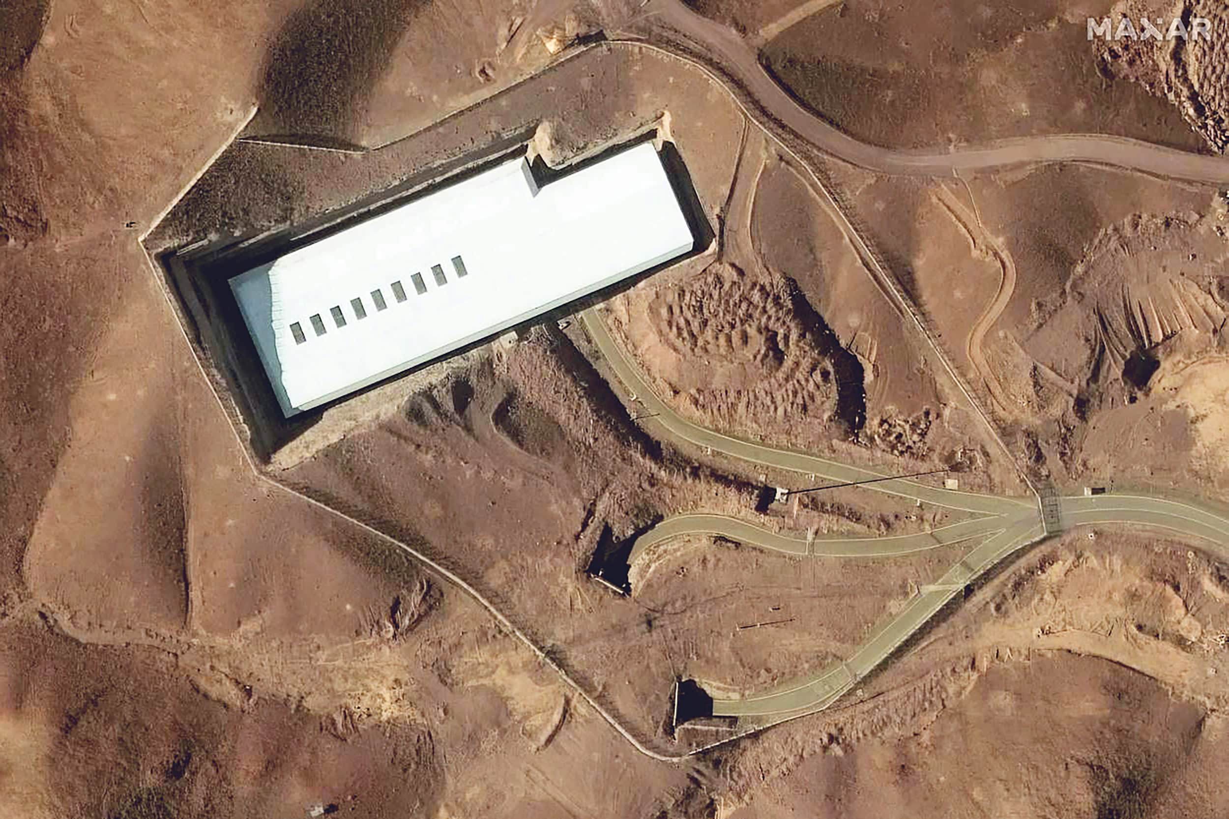 A uranium enrichment site amidst mountains and roads. 