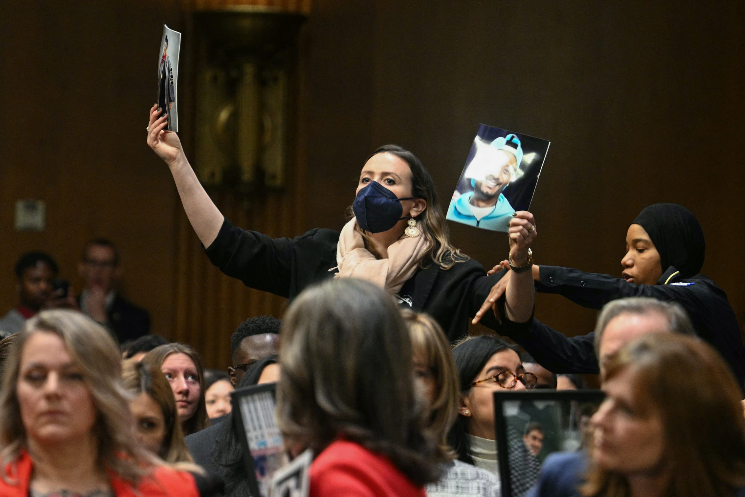 A protester is removed by a Capitol Police officer as Homeland Security Secretary Kristi Noem testifies during a Senate Judiciary Committee hearing on oversight of the Department of Homeland Security, on Capitol Hill in Washington, DC on March 3, 2026.
