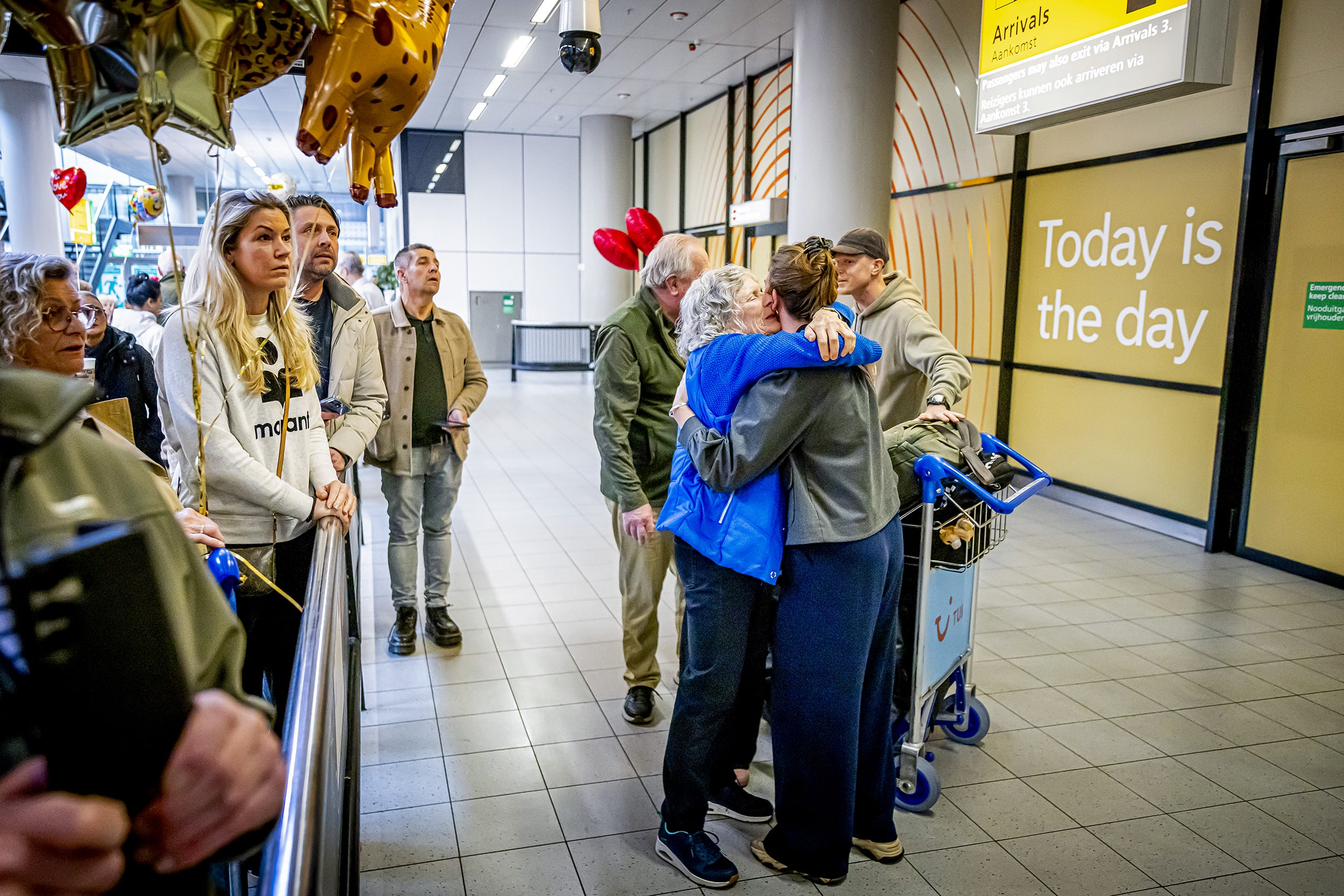 People hug their loved ones.