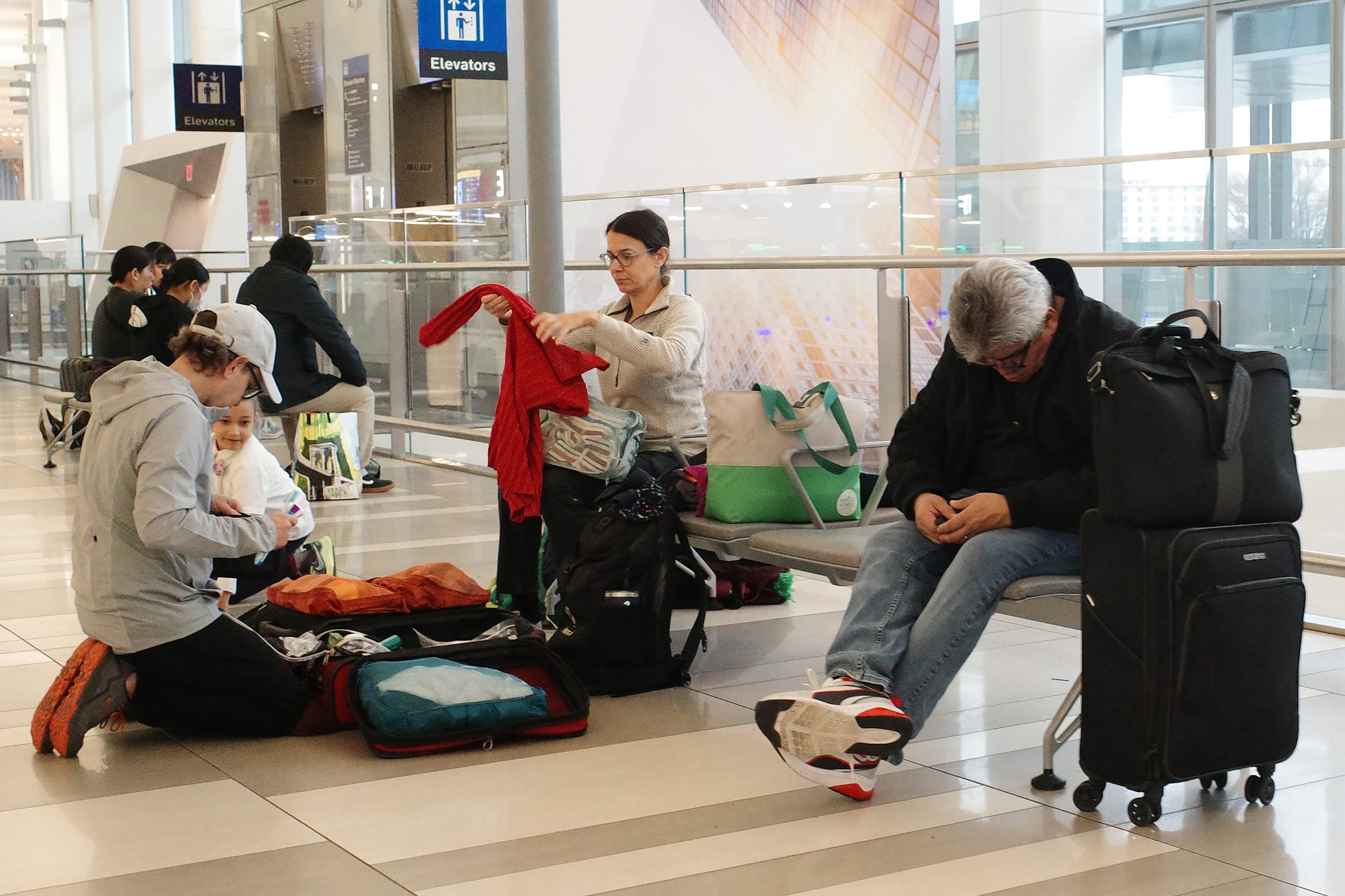 Travelers wait at Terminal B in LaGuardia Airport on March 23, 2026 in New York City. 