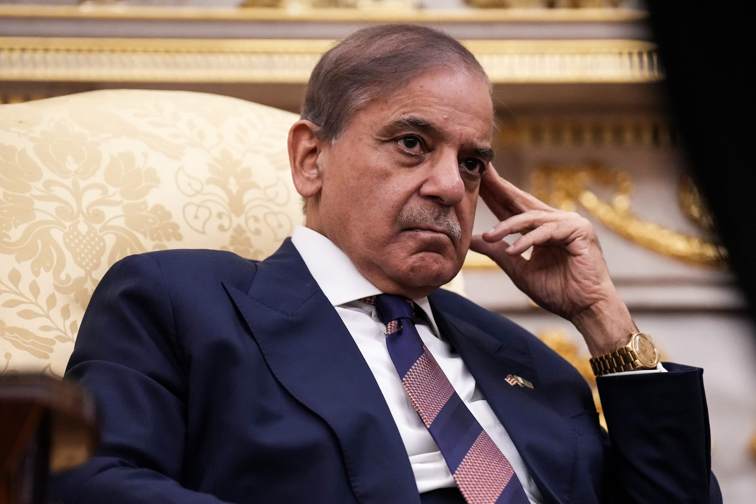 President Trump signs an executive order in the Oval Office.