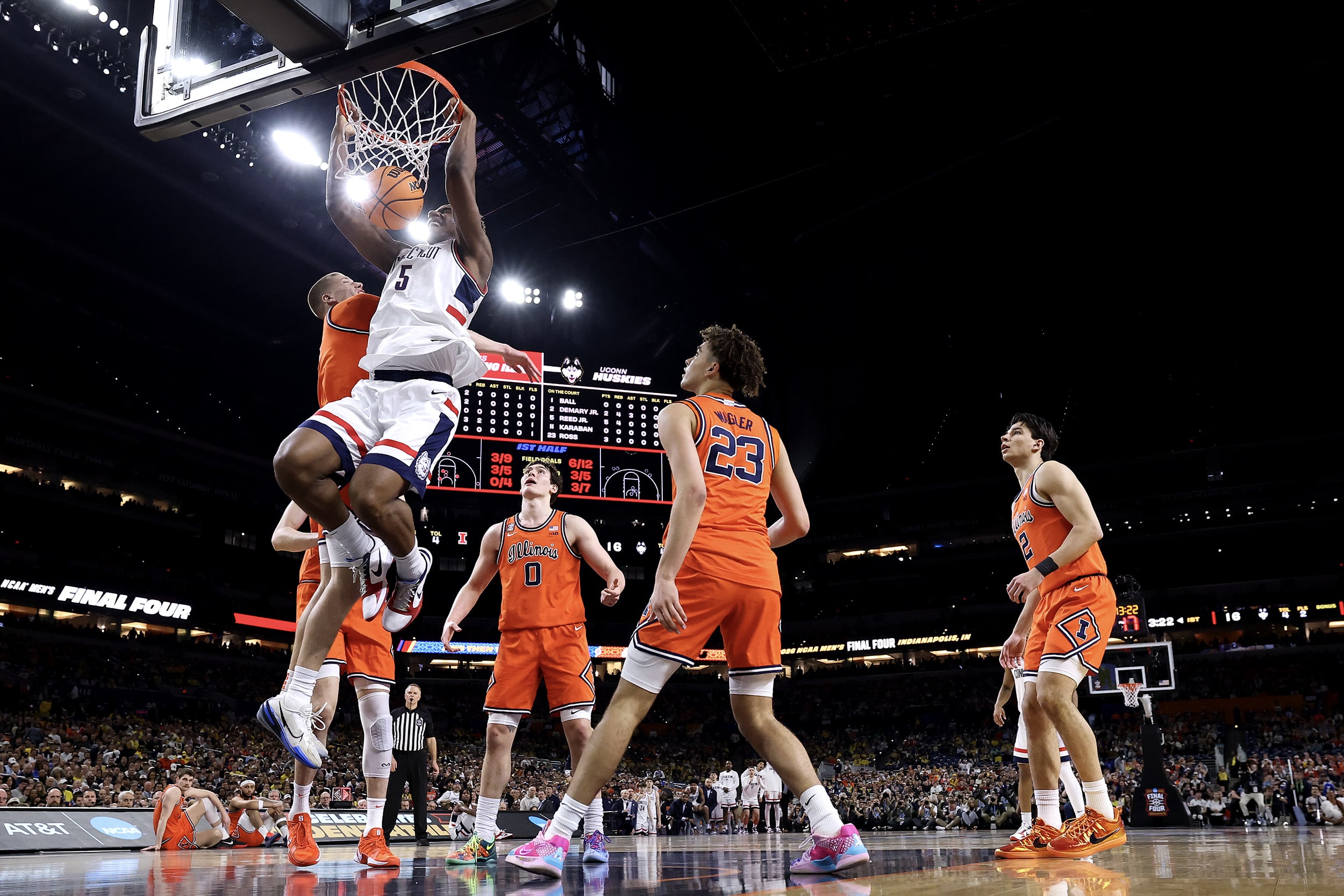 On-court action during a men's NCAA basketball game.