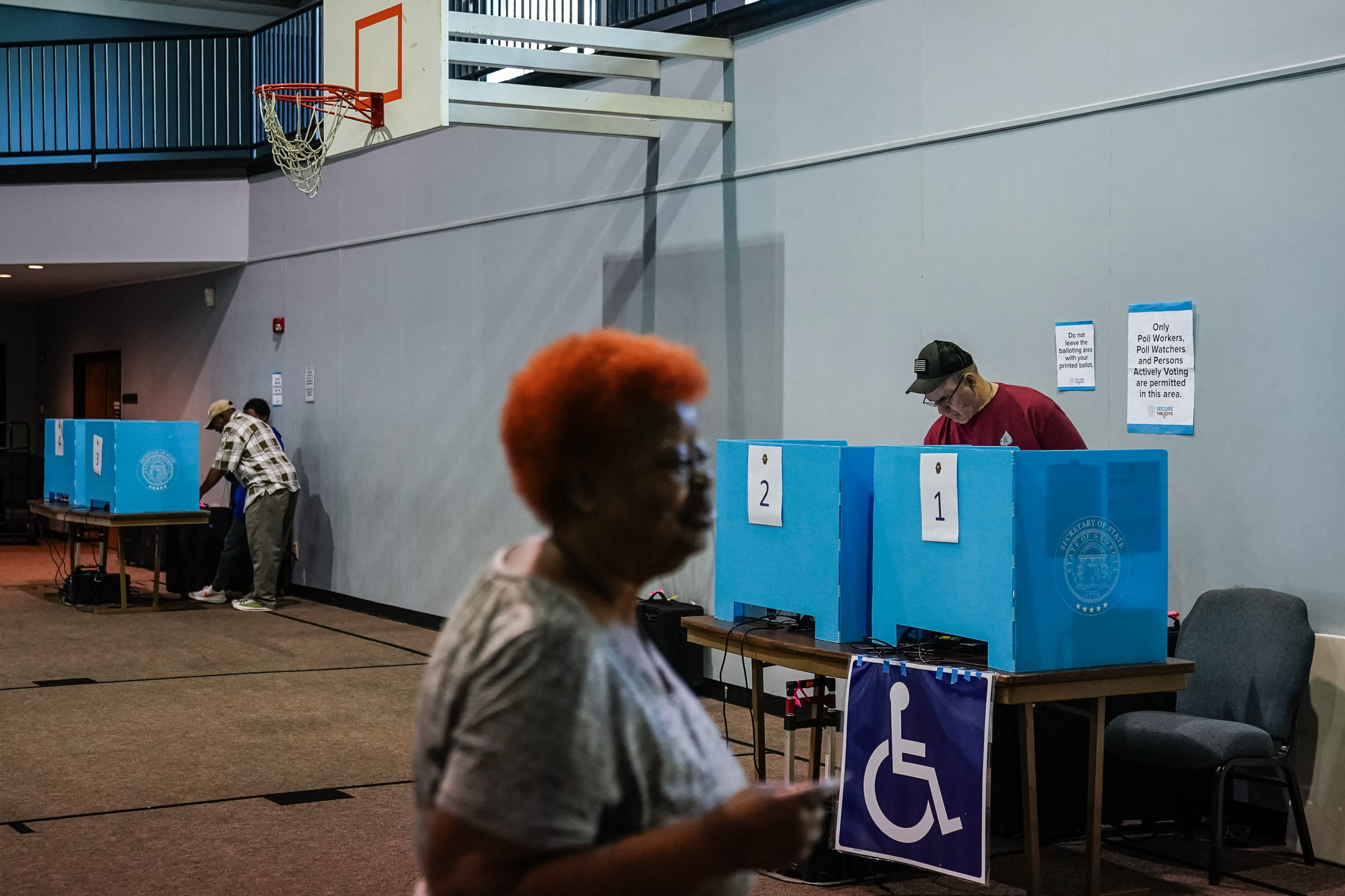 Voters cast their ballots at a polling location.