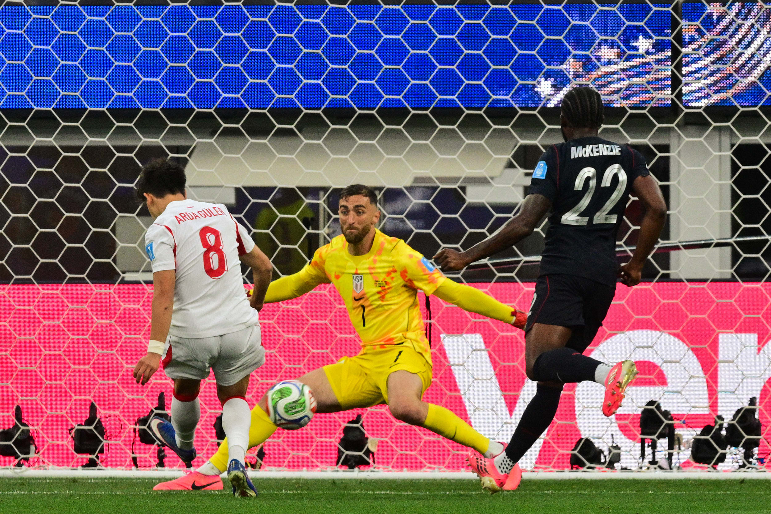 Turkey's midfielder #08 Arda Guler (L) scores his team's first goal during the USA vs. Turkey.